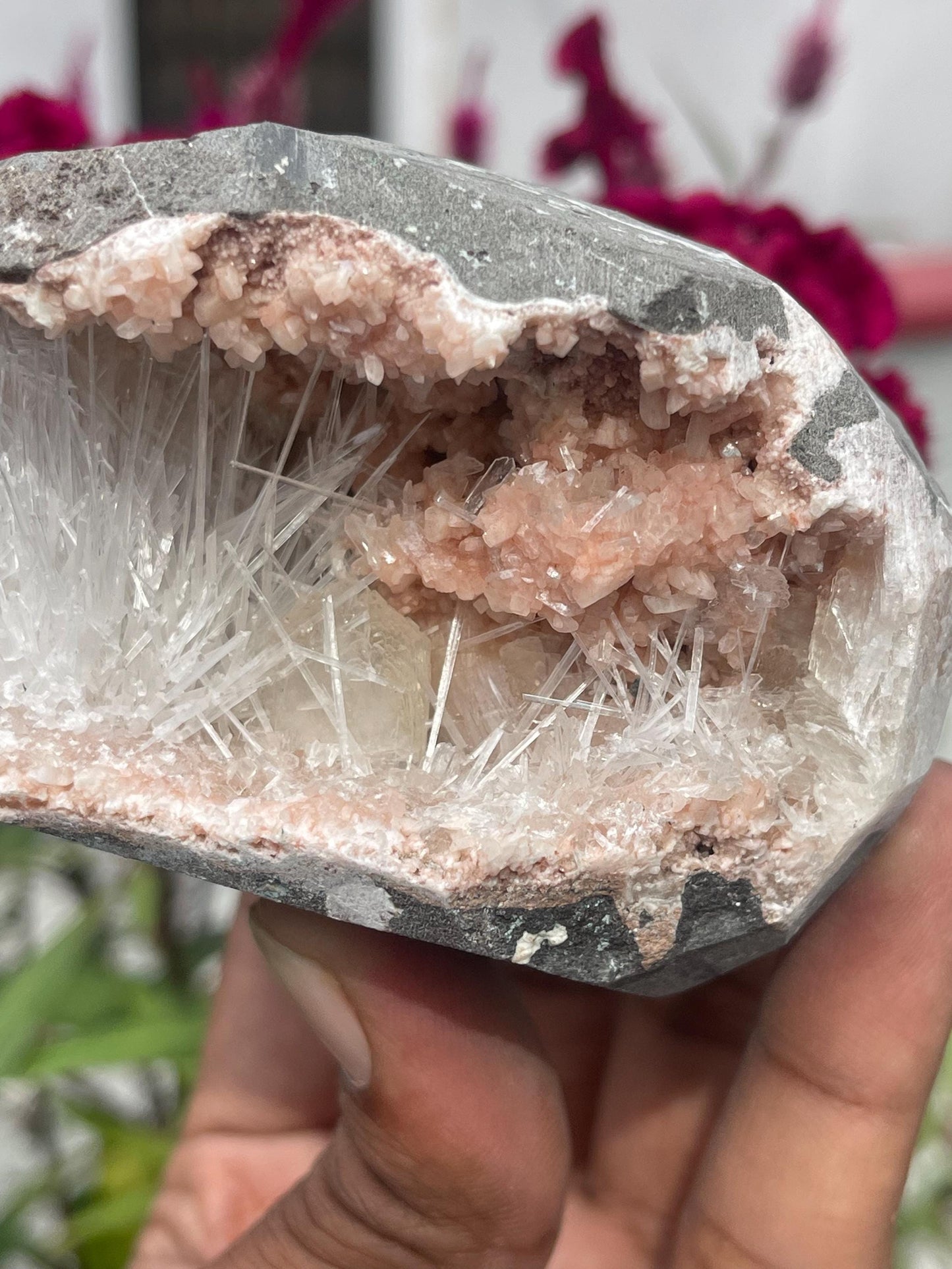 Scolecite spray with stilbite crystal inside orange heulandite geode