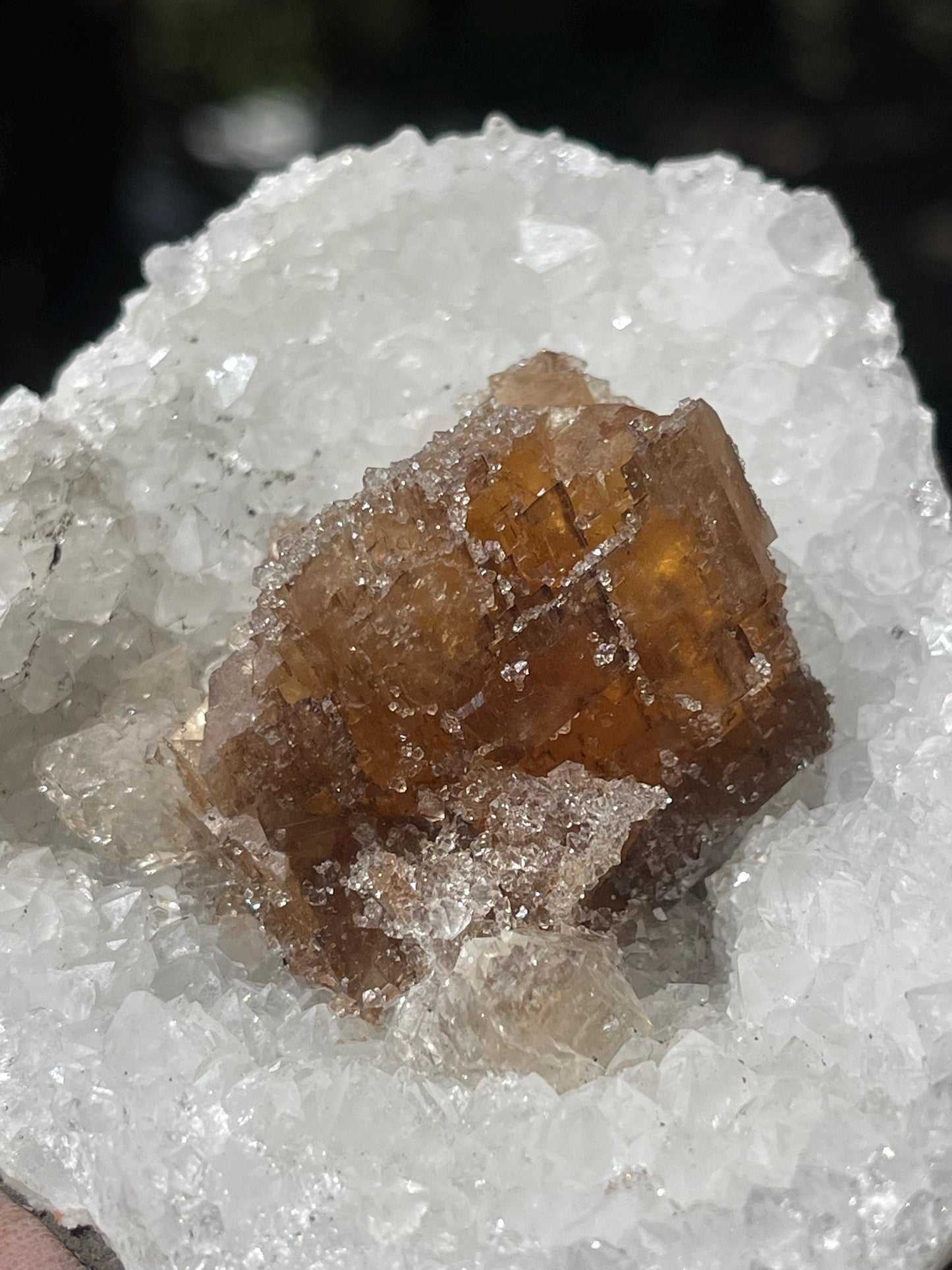 natural brown calcite crystal on quartz