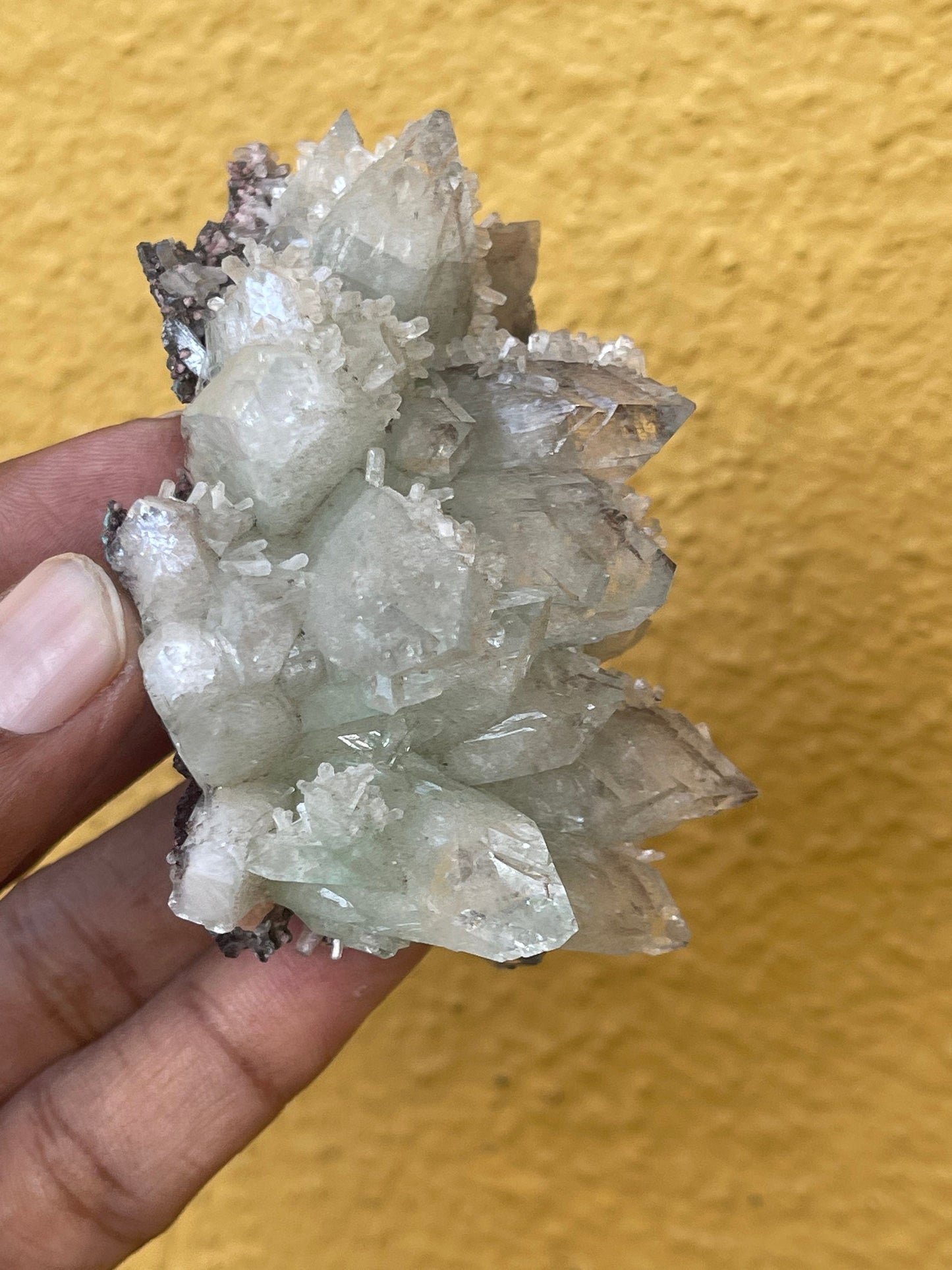 Pointed light green apophyllite flower with stilbite