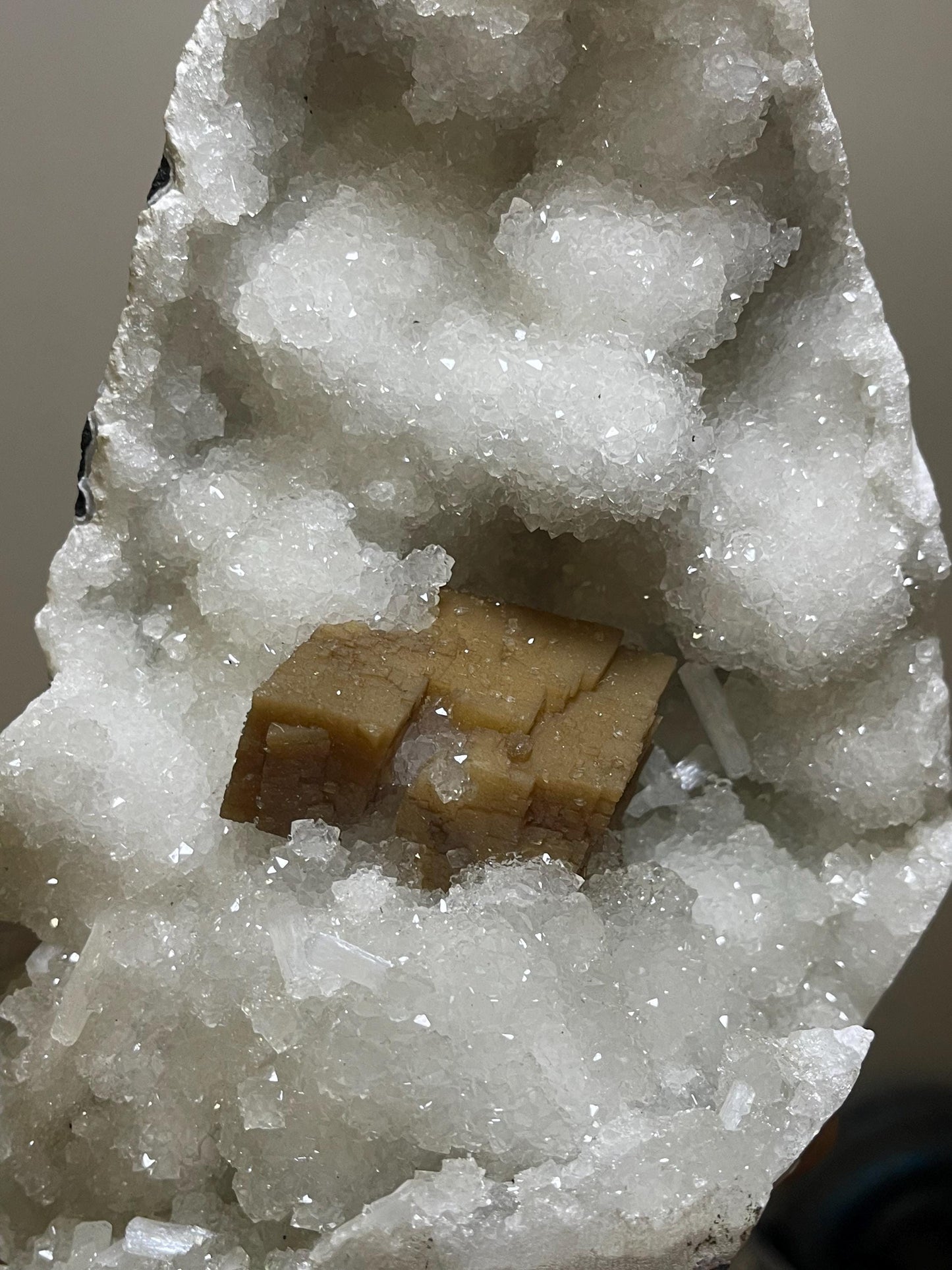 rare find. brown cubical calcite crystal with stilbite petals on quartz matrix