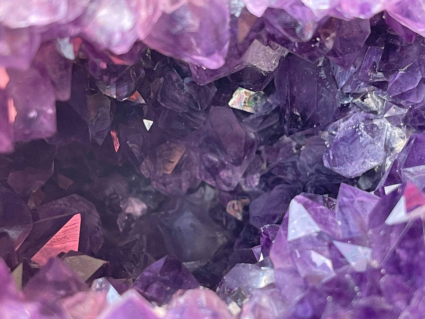 Natural amethyst geode with Okenite.