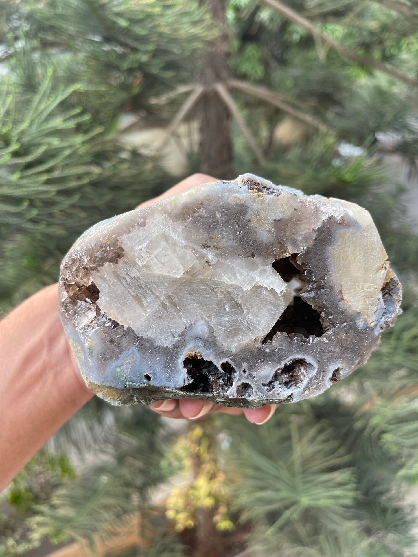 Rare formation of calcite crystal on amethyst natural specimen