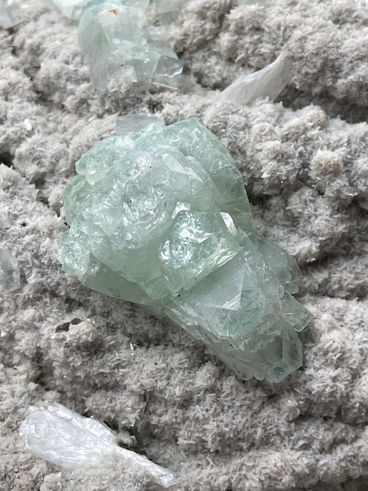 Green apophyllite crystal on chalcedony matrix