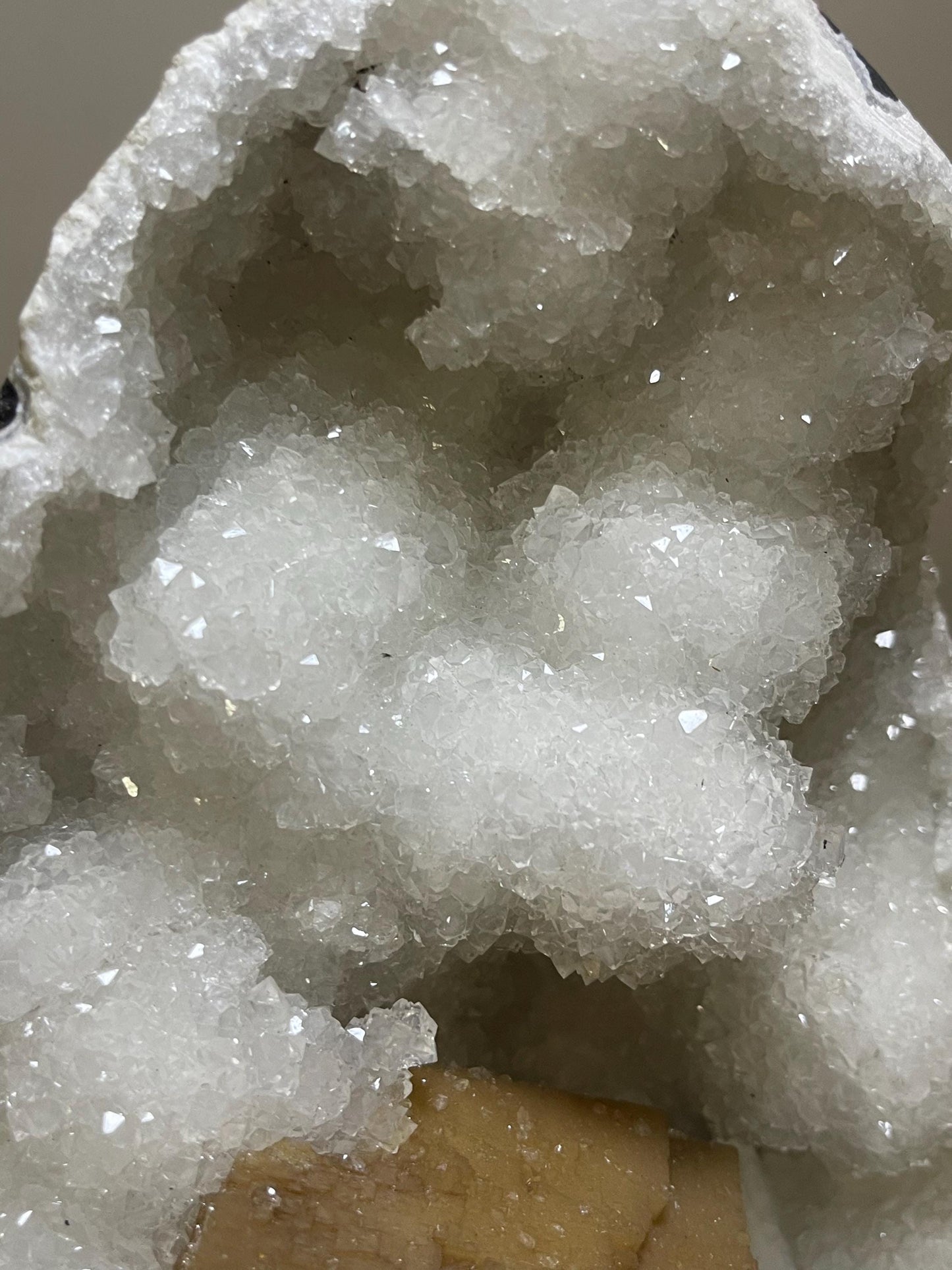 rare find. brown cubical calcite crystal with stilbite petals on quartz matrix