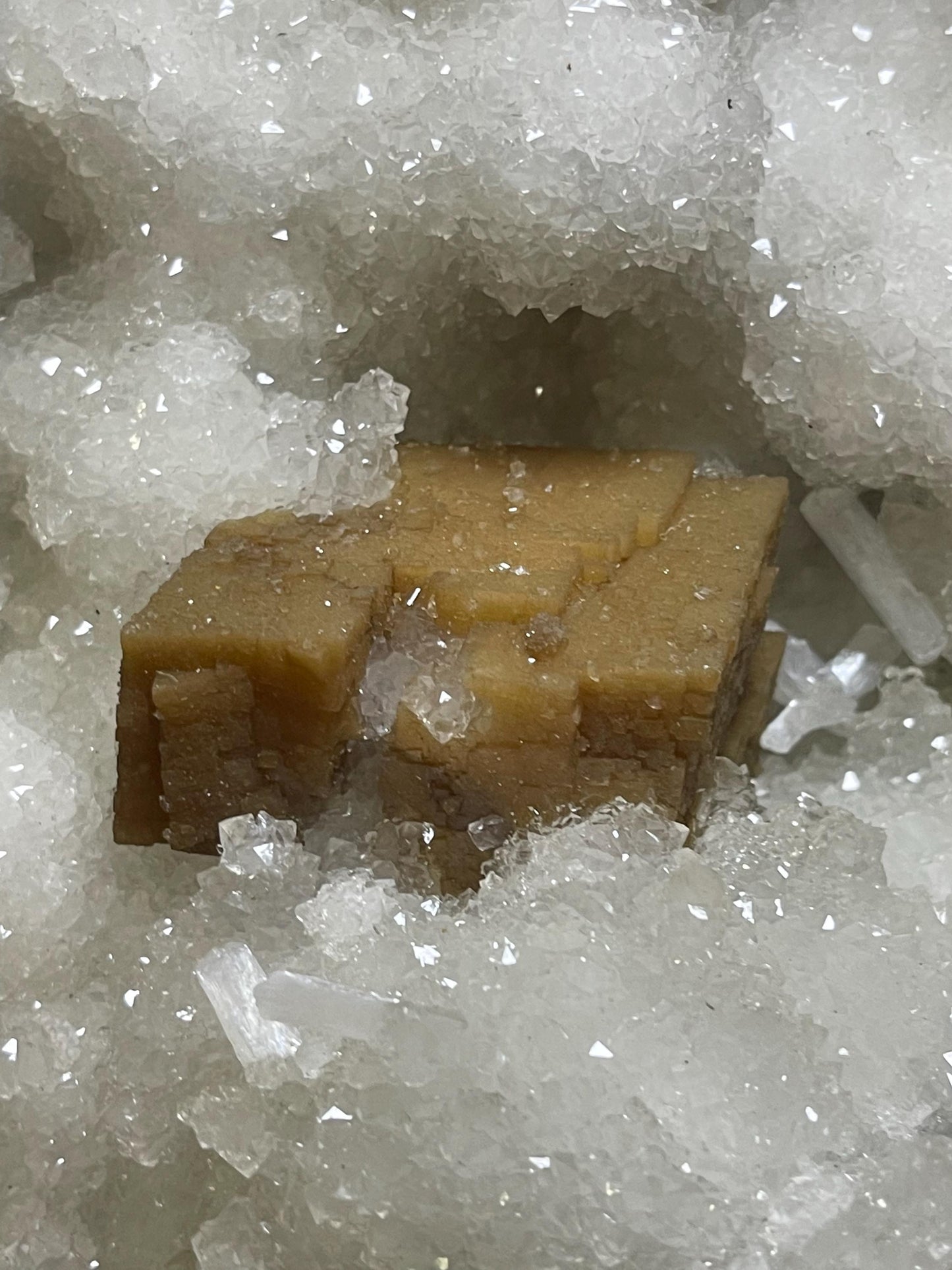 rare find. brown cubical calcite crystal with stilbite petals on quartz matrix