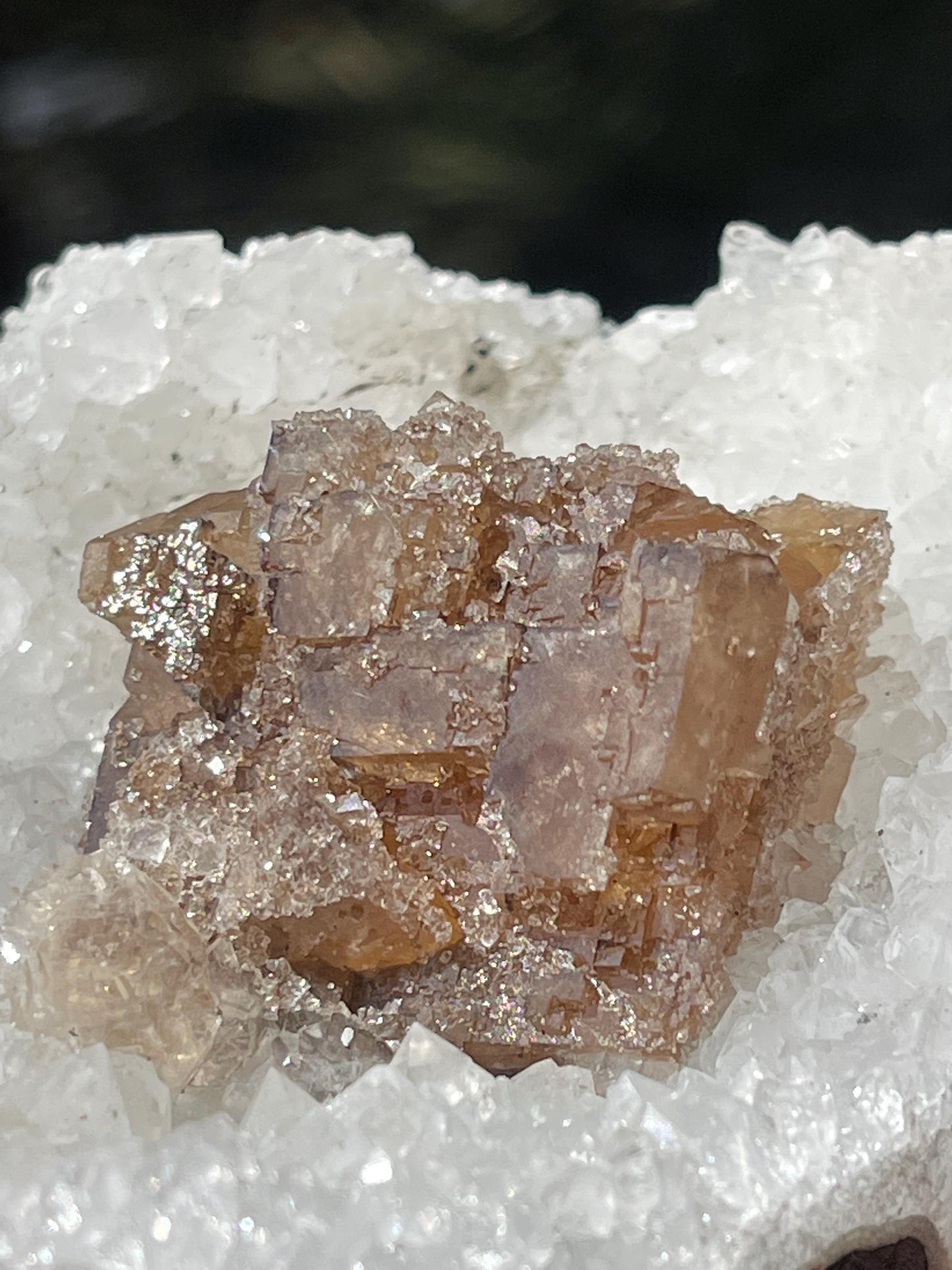 natural brown calcite crystal on quartz