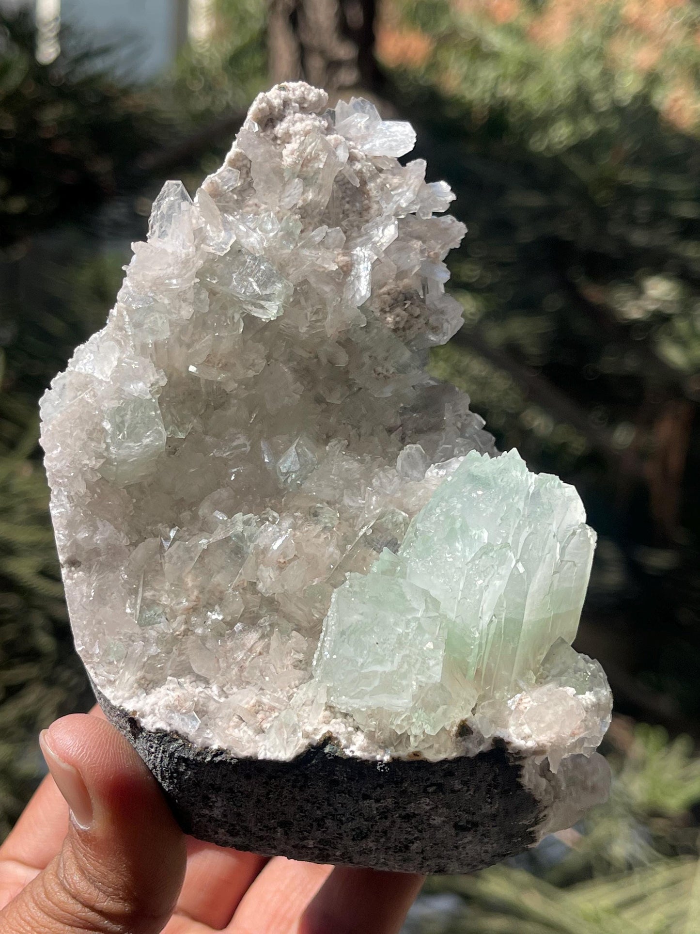 green apophyllite flower with small stilbite on chalcedony matrix