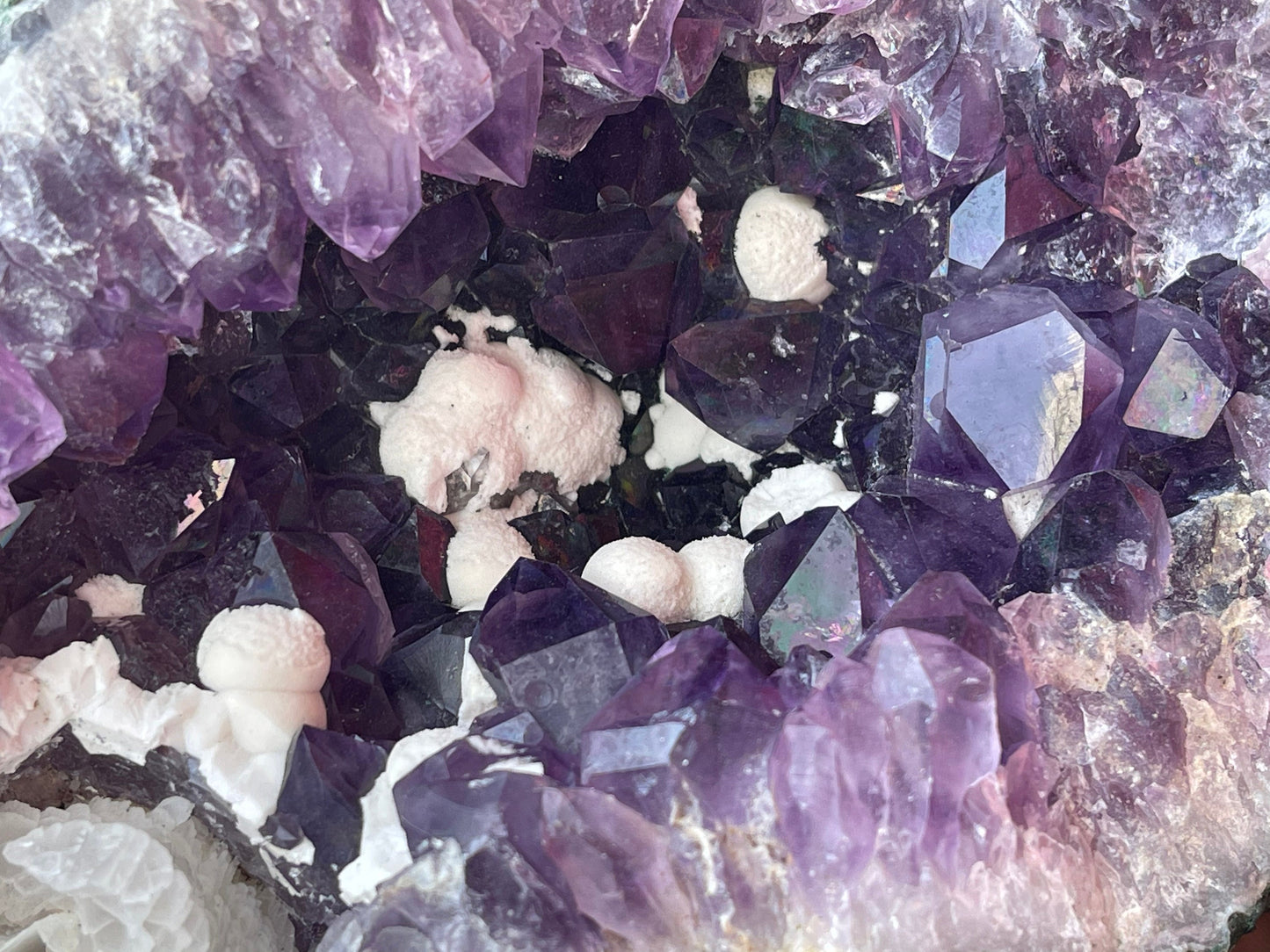 Natural amethyst geode with Okenite.