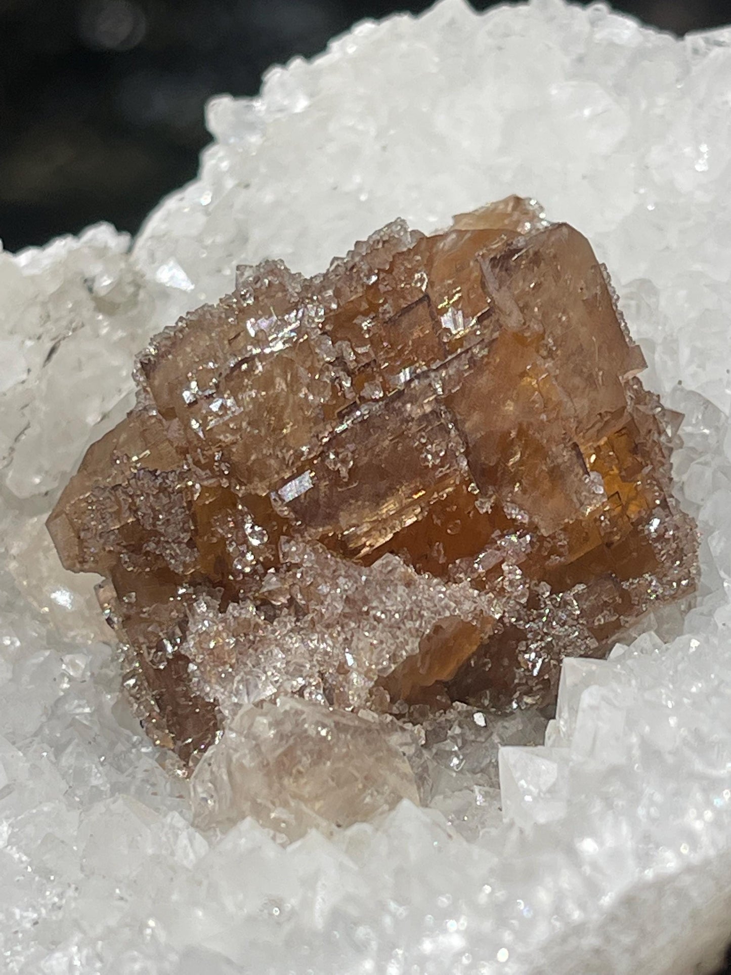 natural brown calcite crystal on quartz