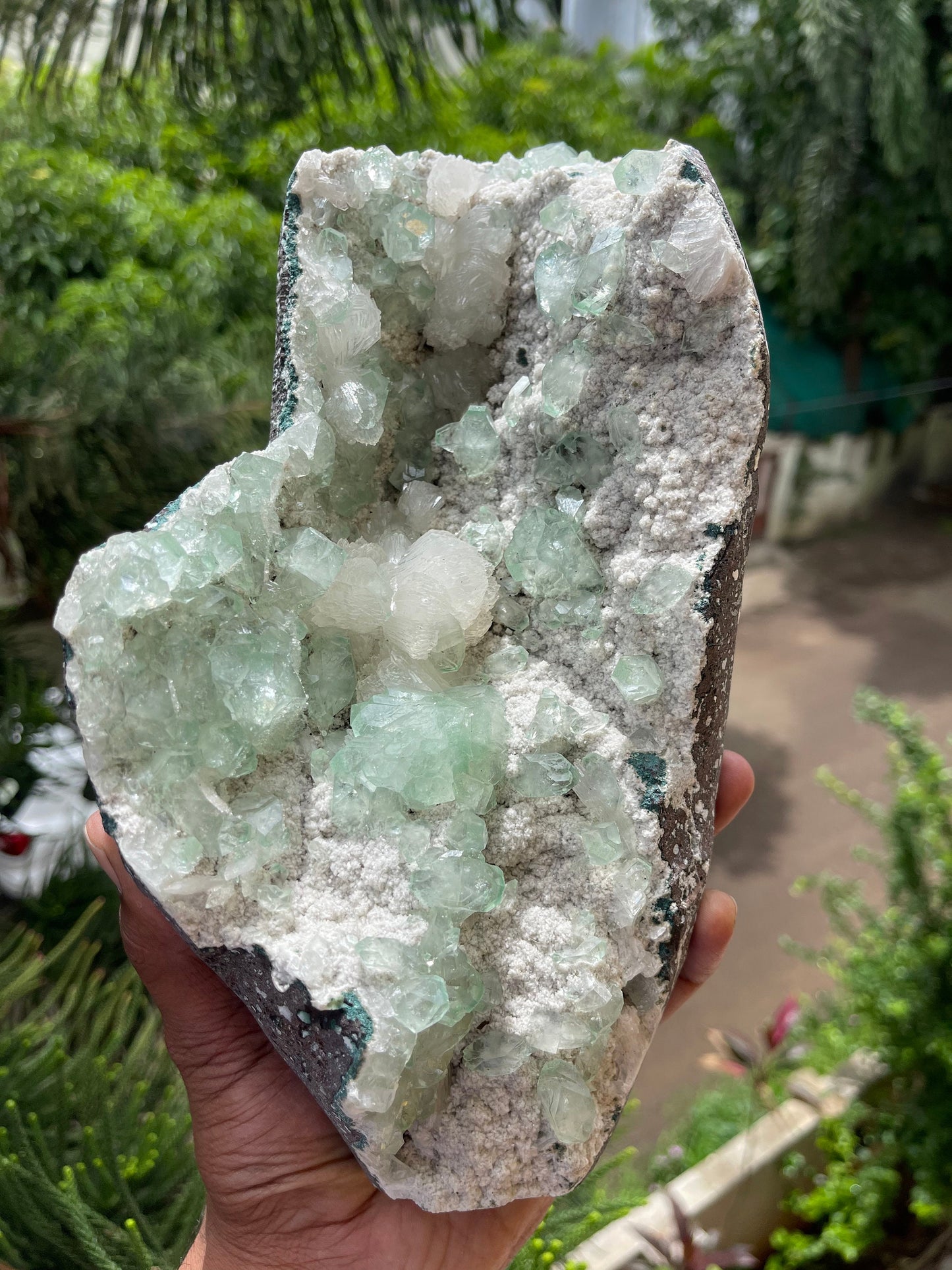 Green apophyllite crystal on white chalcedony matrix