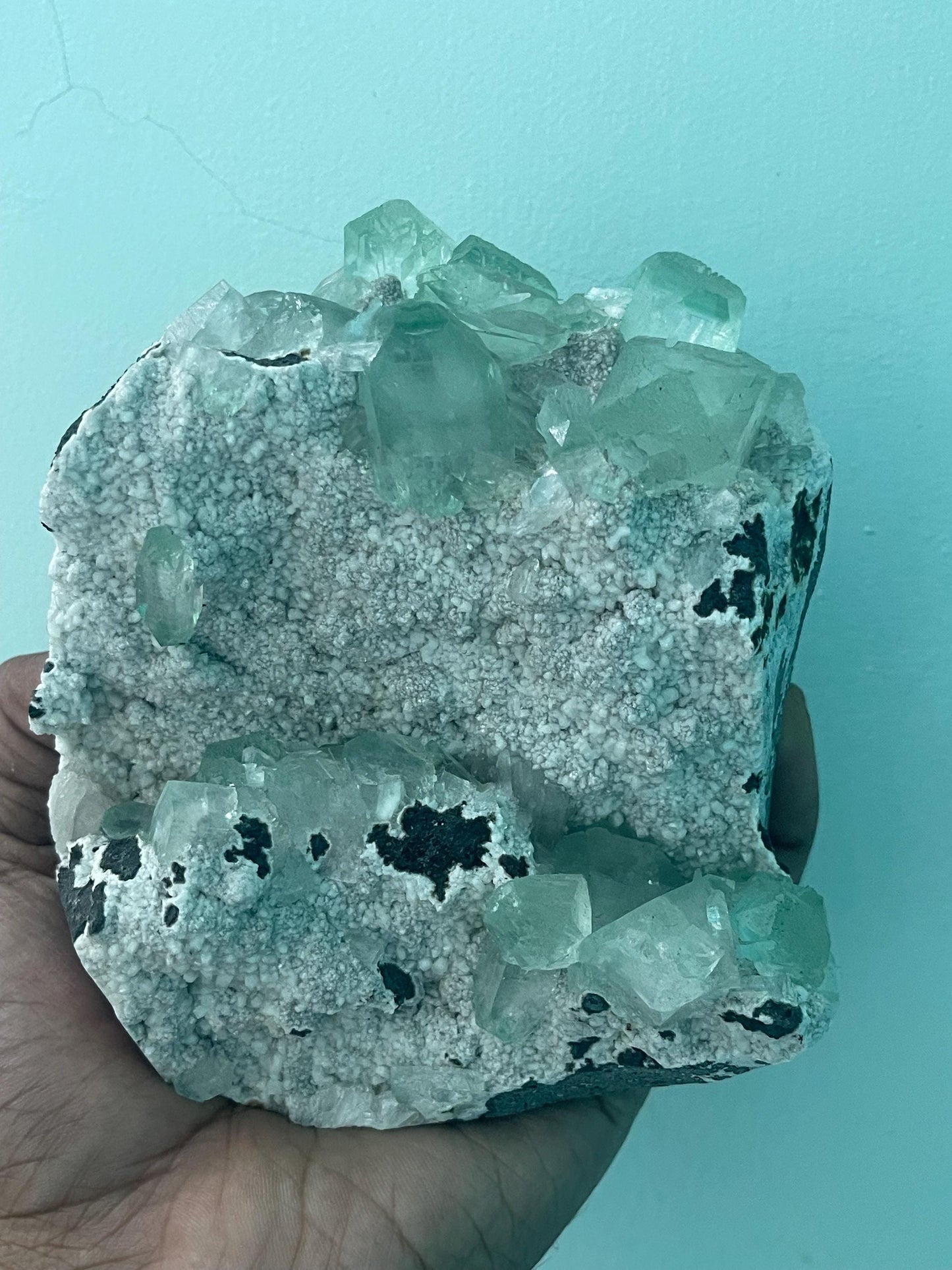 green apophyllite crystals on white chalcedony matrix