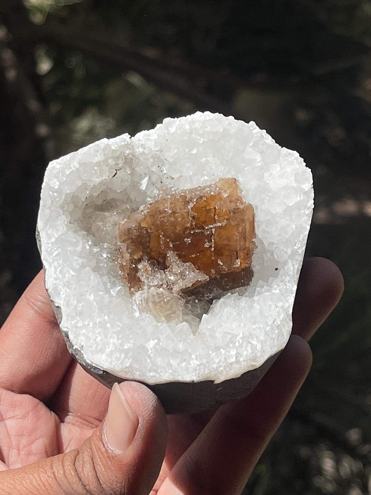 natural brown calcite crystal on quartz