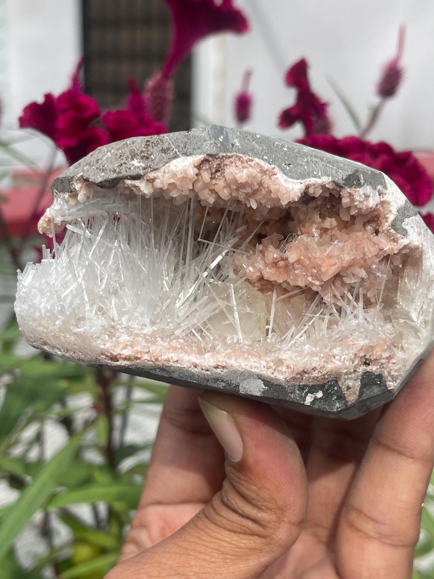 Scolecite spray with stilbite crystal inside orange heulandite geode