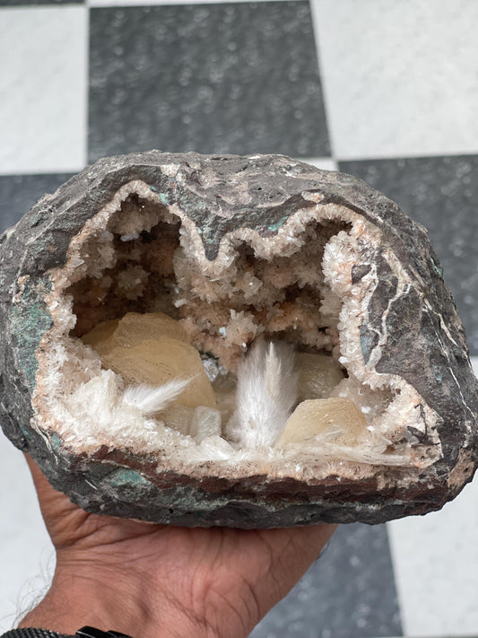Combination of Scolecite sprays and peach stilbites inside heulandite geode