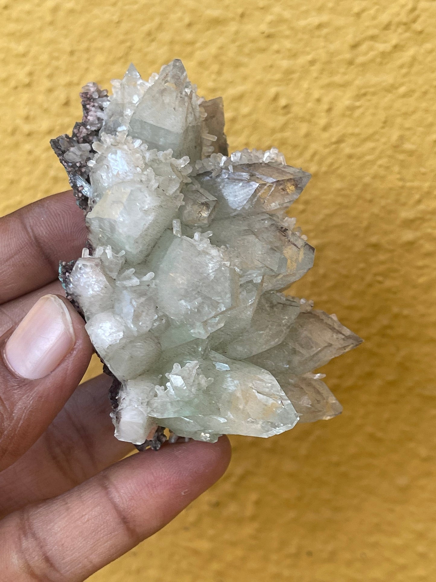 Pointed light green apophyllite flower with stilbite