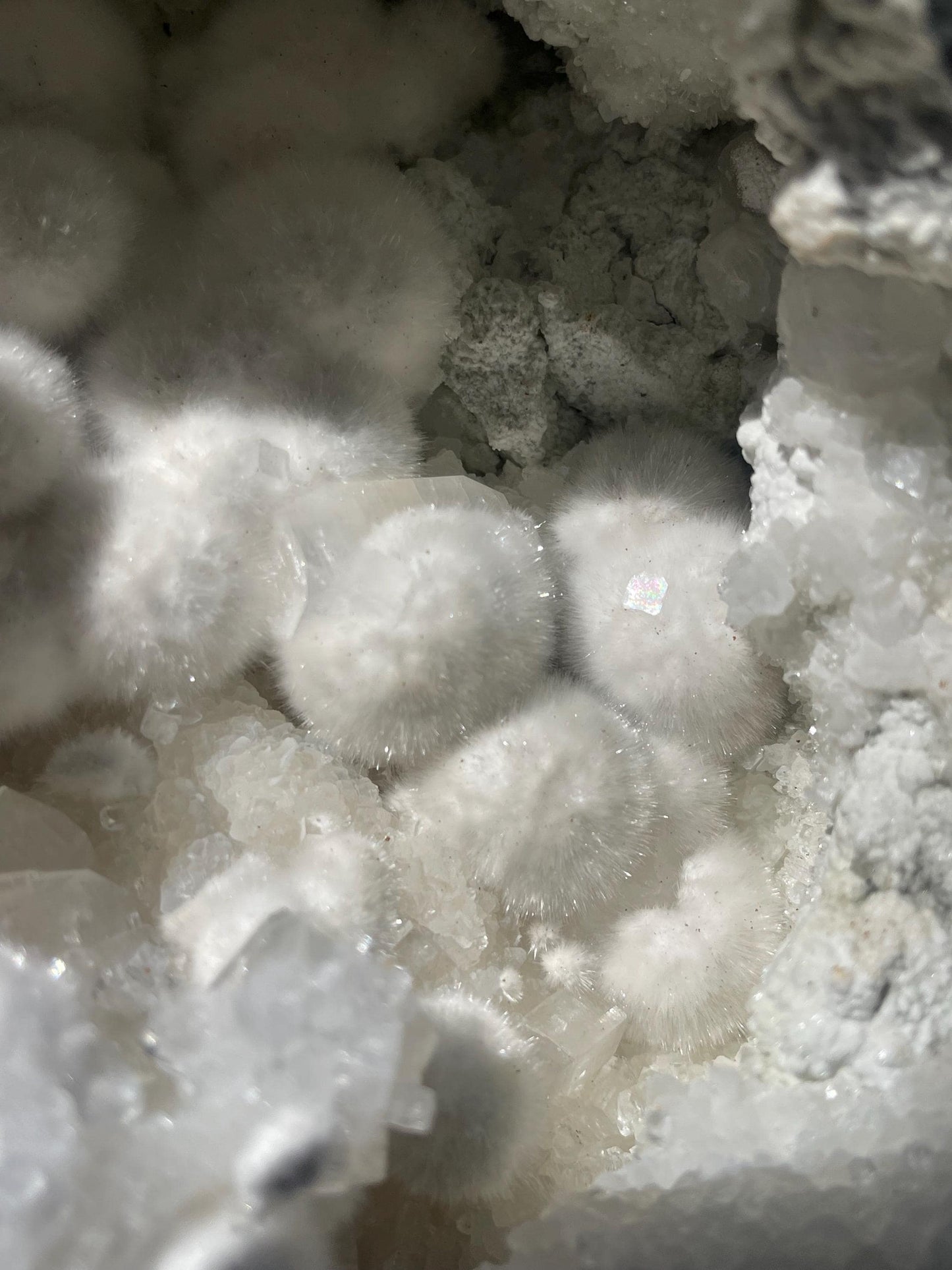 okenite big puffs balls on apophyllite inside geode