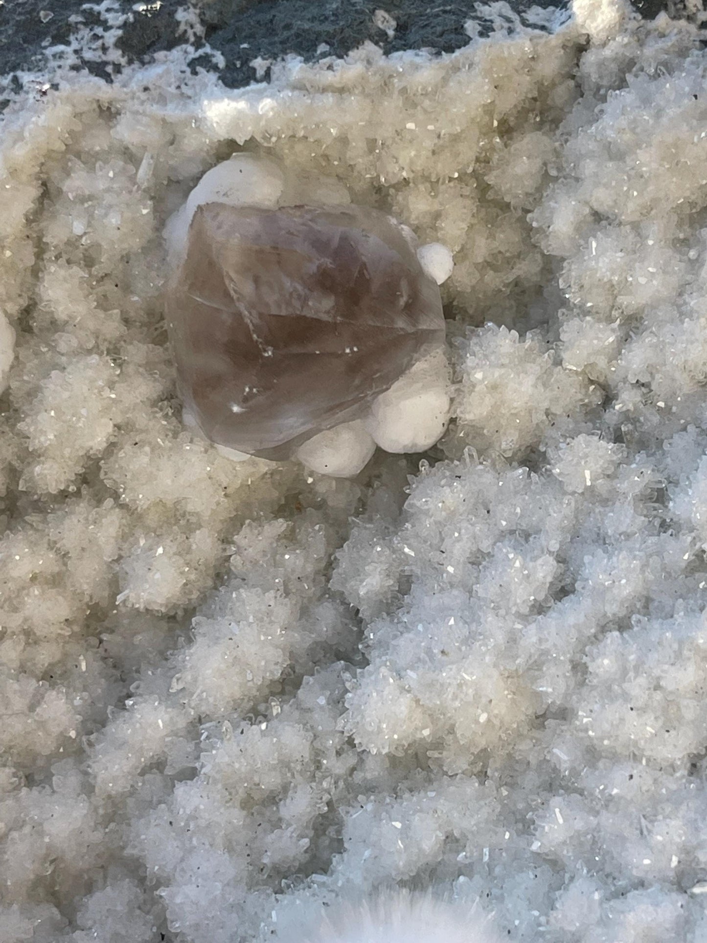 combination of okenite calcite gyrolite on white chalcedony matrix