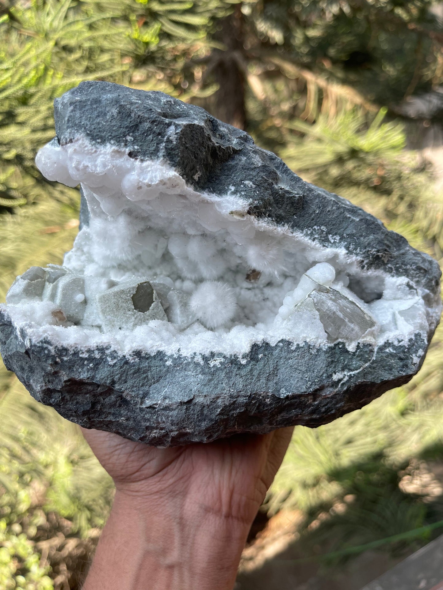 Okenite balls with calcite natural mineral geode