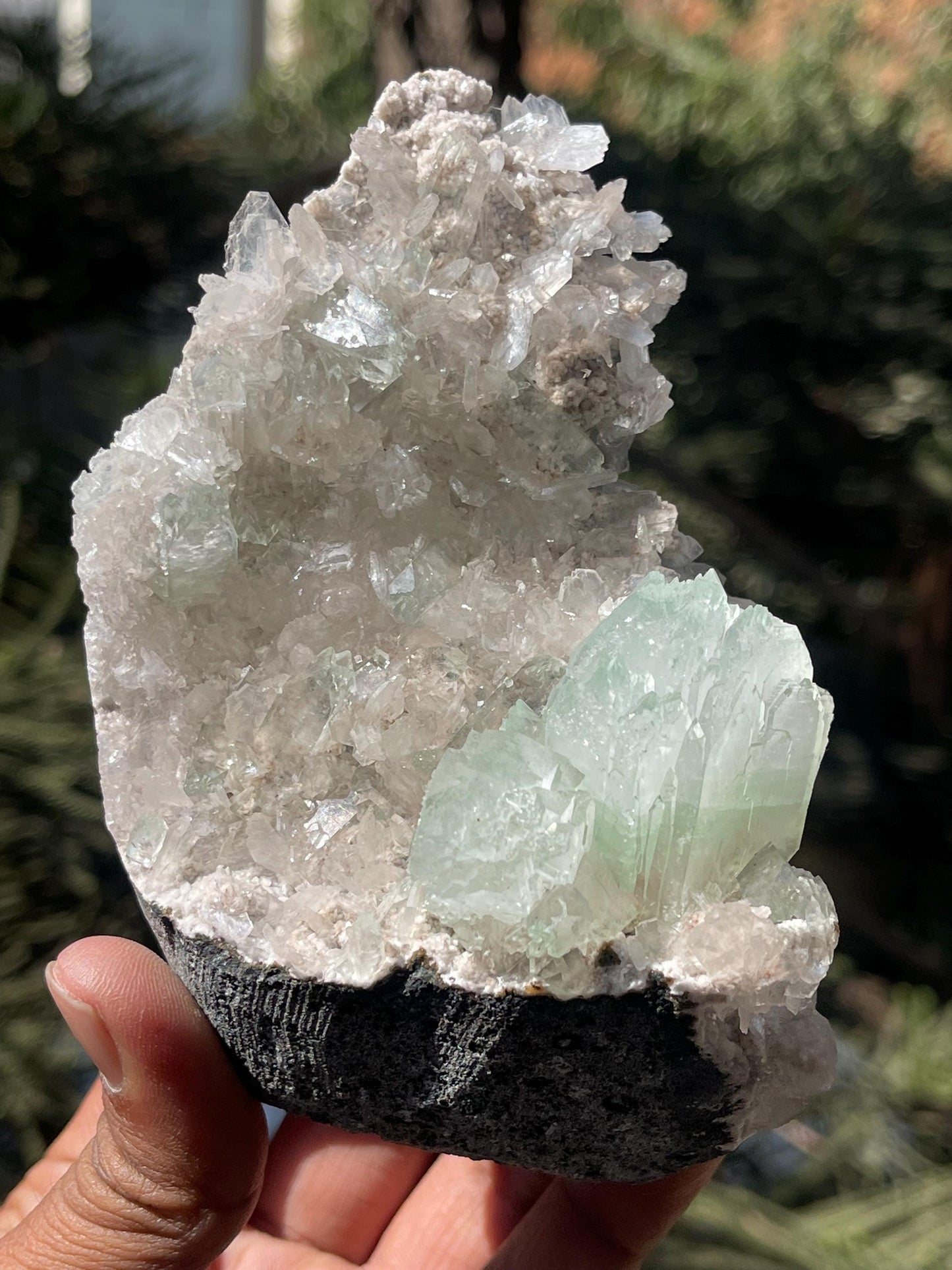green apophyllite flower with small stilbite on chalcedony matrix
