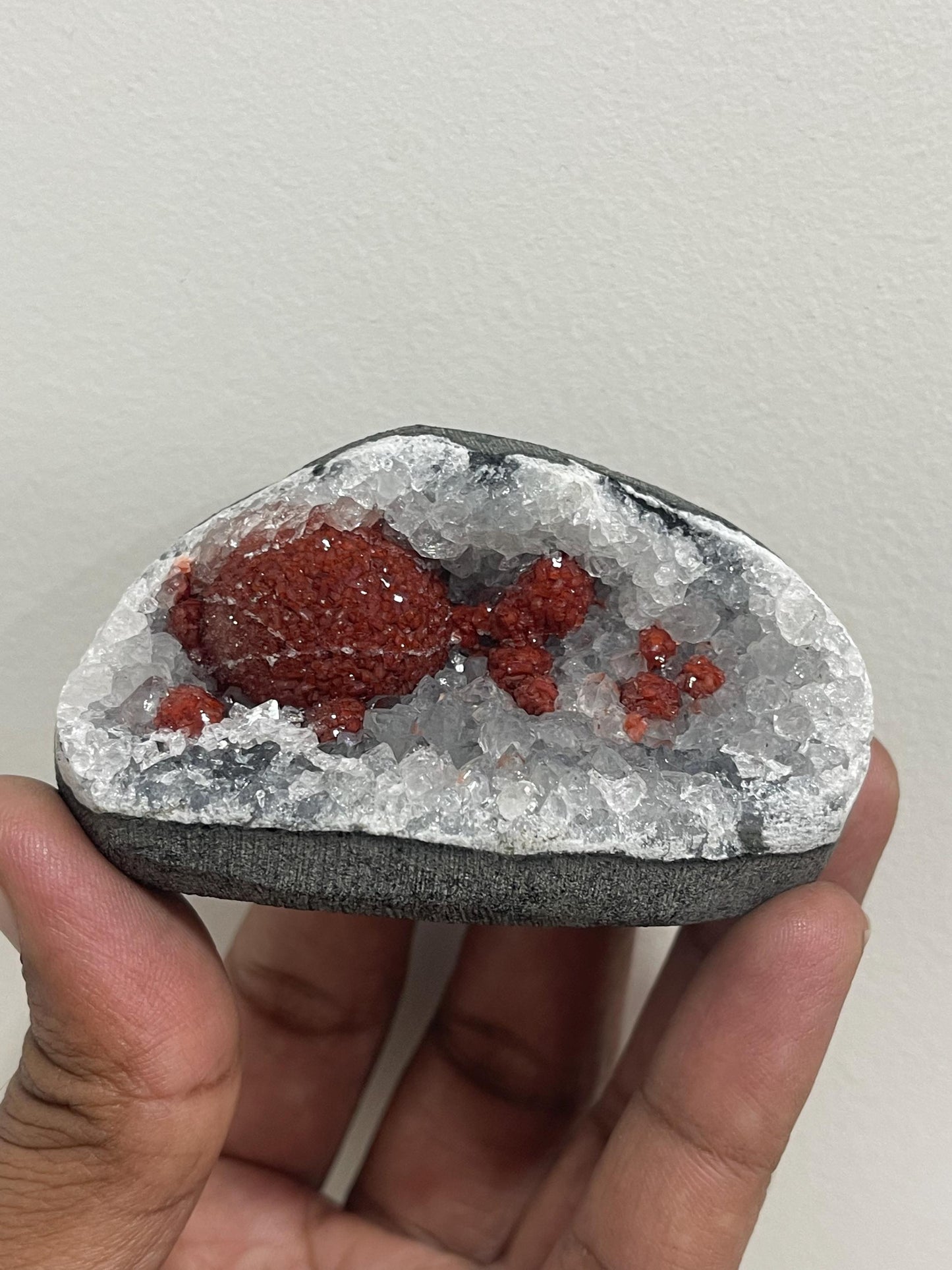 Rare find .. Red fluoride ball on blue quartz crystal