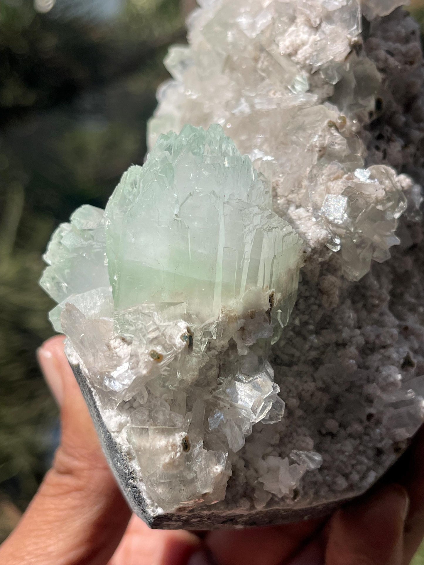 green apophyllite flower with small stilbite on chalcedony matrix