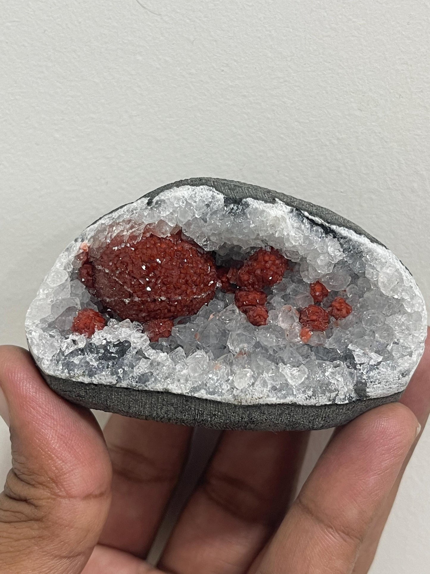 Rare find .. Red fluoride ball on blue quartz crystal