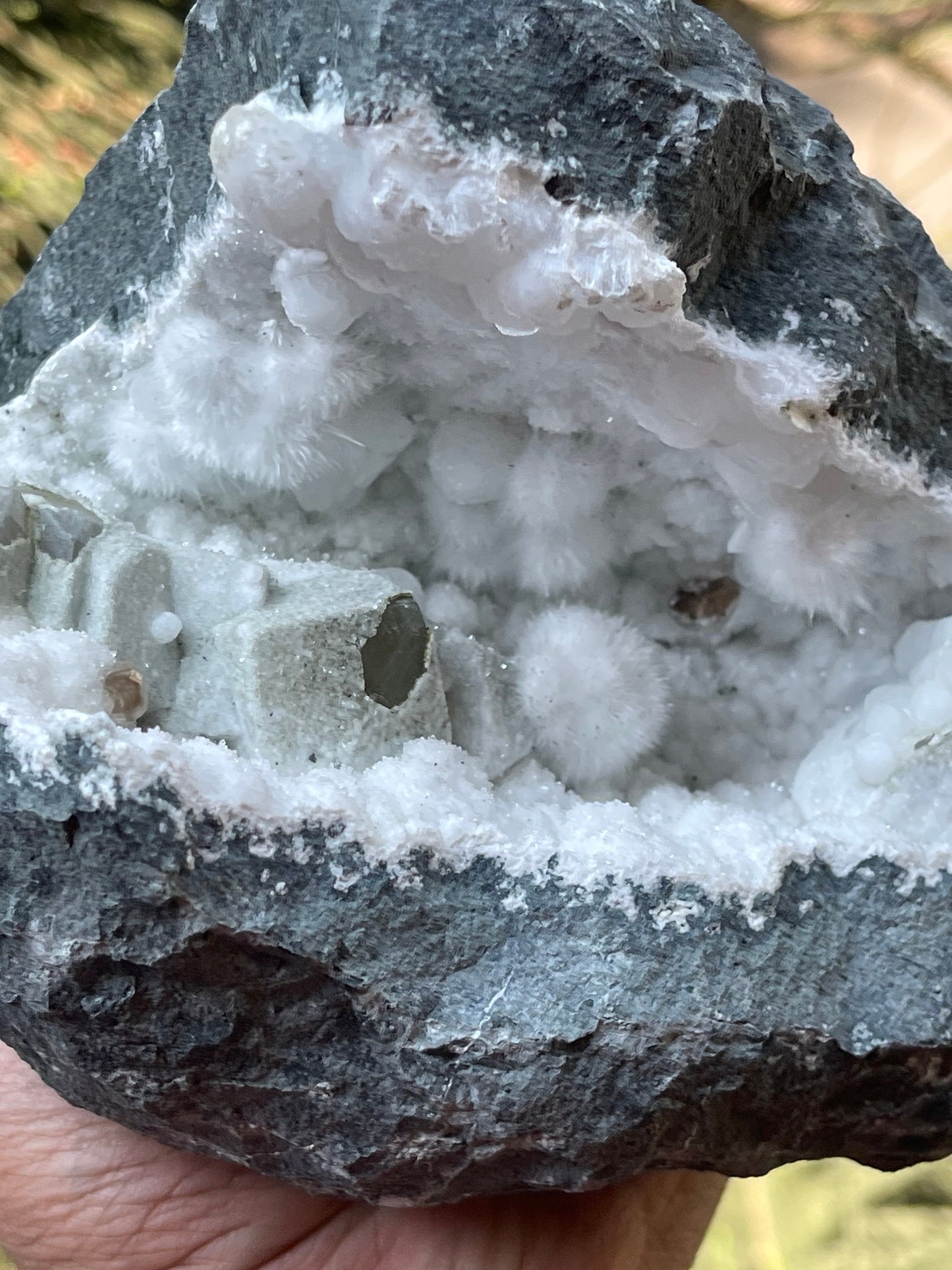 Okenite balls with calcite natural mineral geode