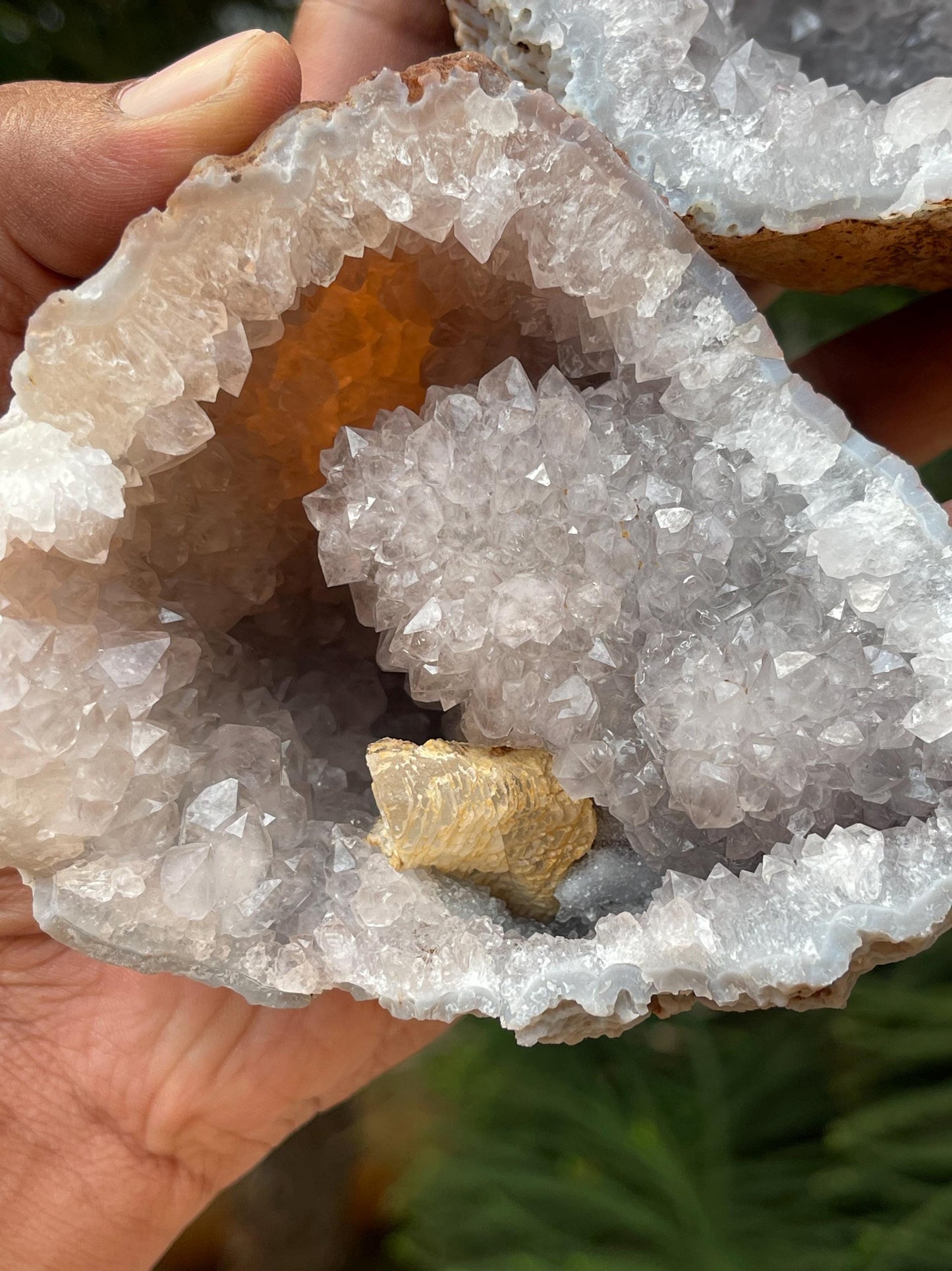 Calcite crystal inside quartz geode