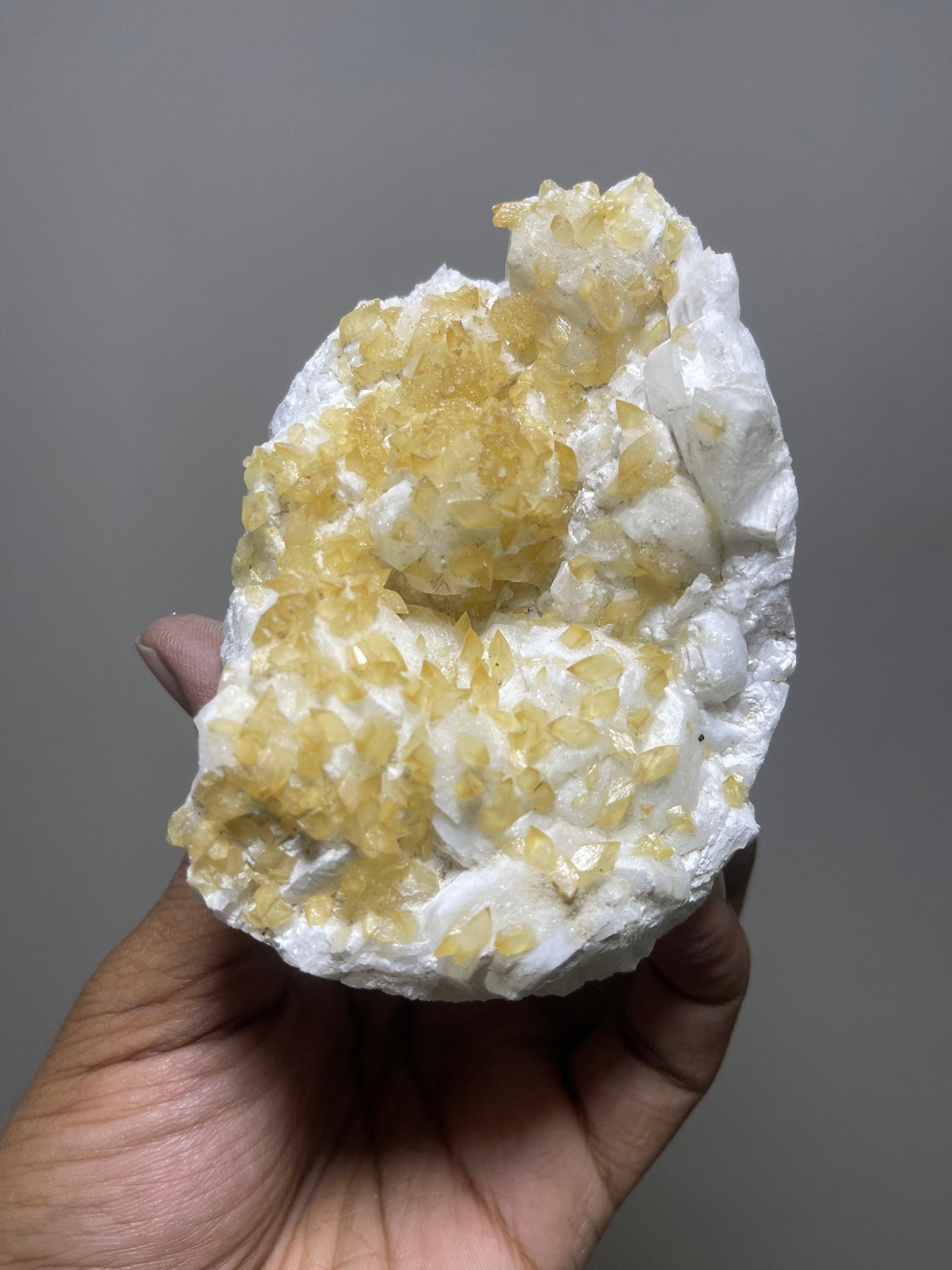 Rare find ..! Golden calcite  crystal on white apophyllite