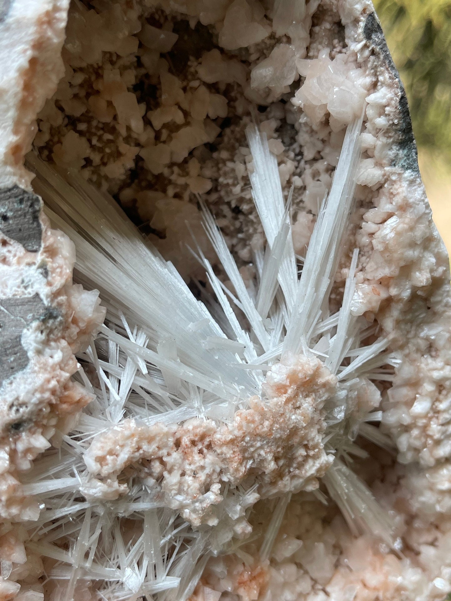 Scolecite spray with orange heulandite crystals inside geode natural specimen