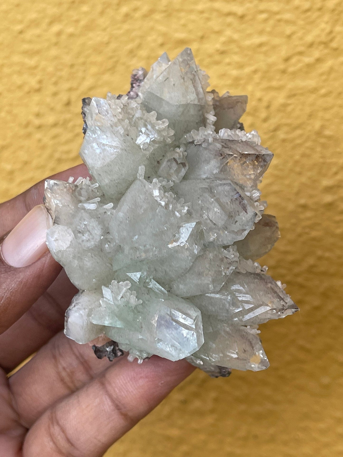 Pointed light green apophyllite flower with stilbite