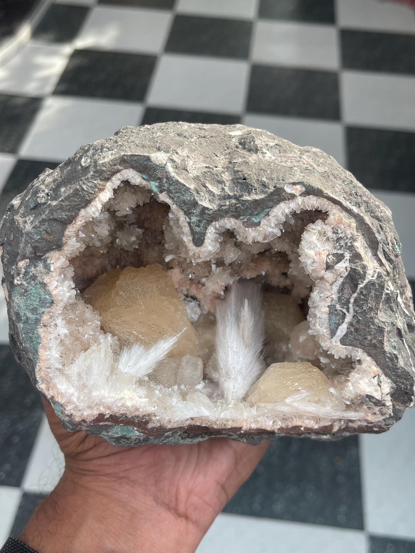 Combination of Scolecite sprays and peach stilbites inside heulandite geode