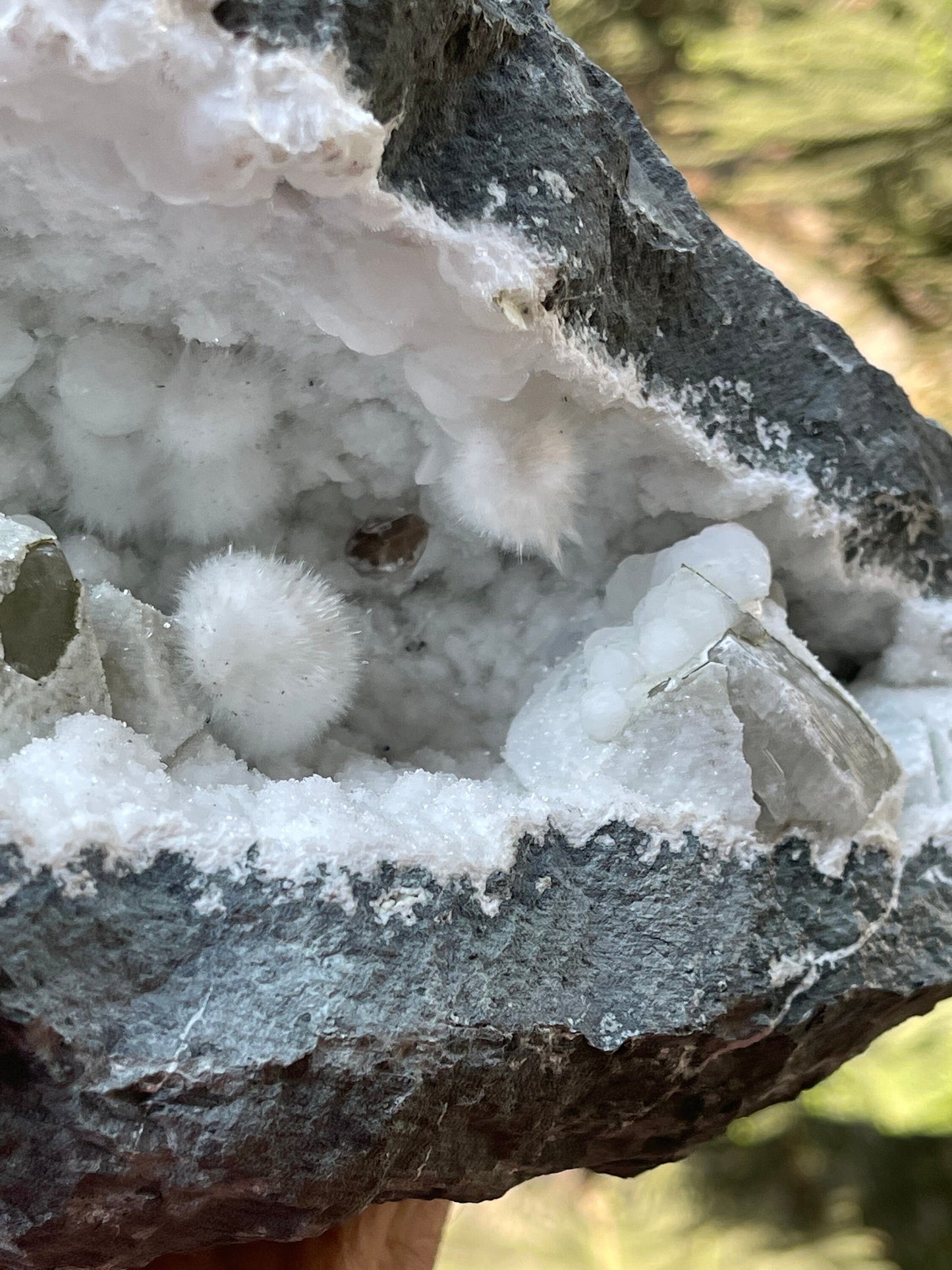 Okenite balls with calcite natural mineral geode