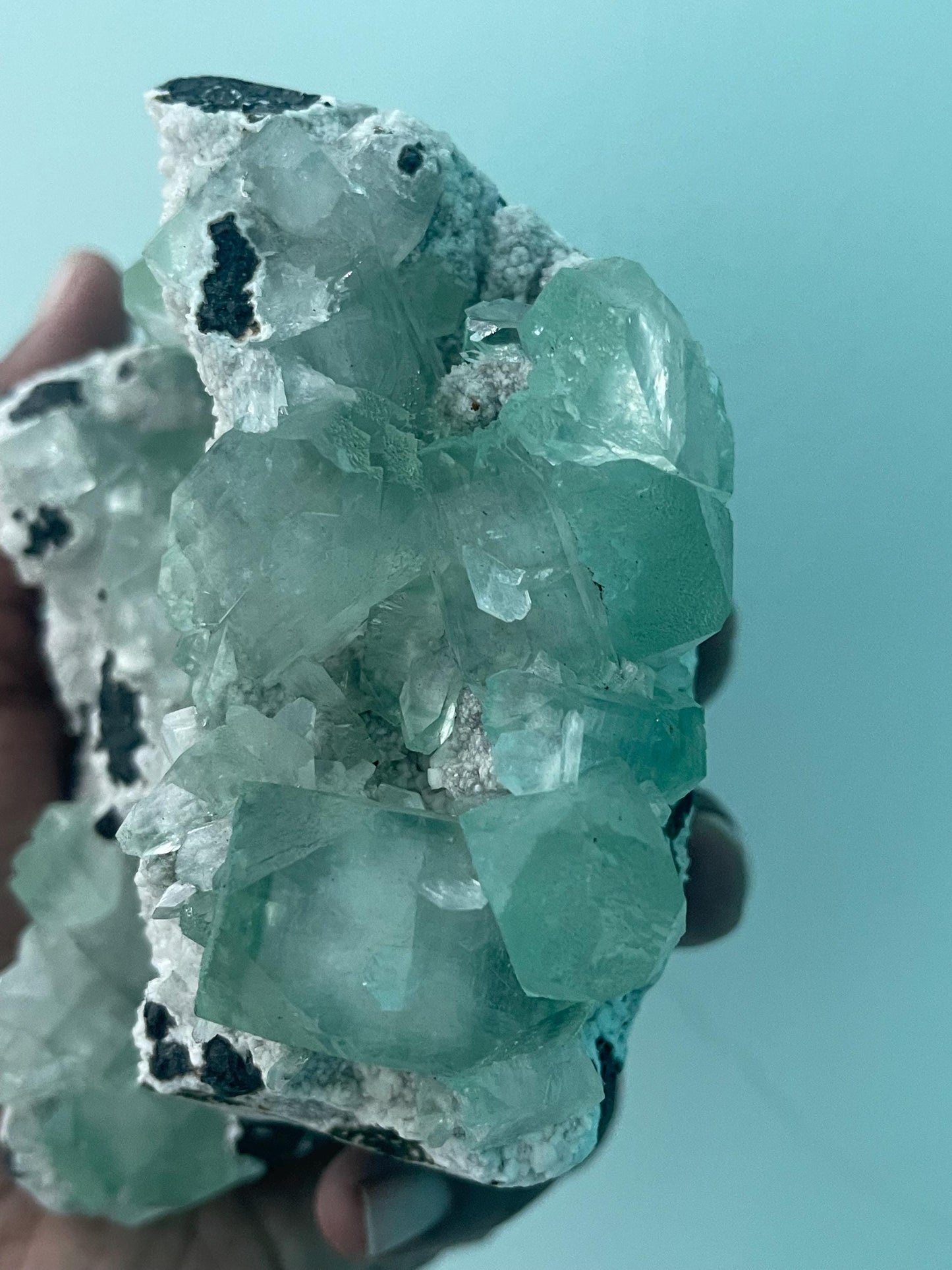 green apophyllite crystals on white chalcedony matrix