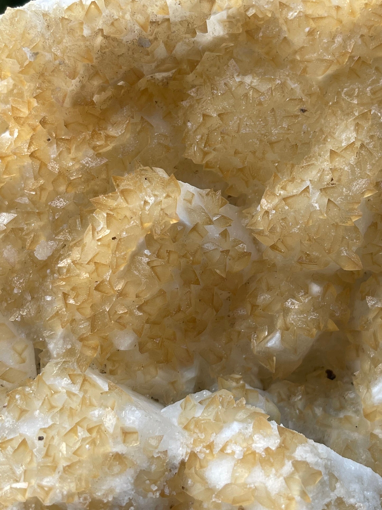 Golden calcite crystal on white apophyllite