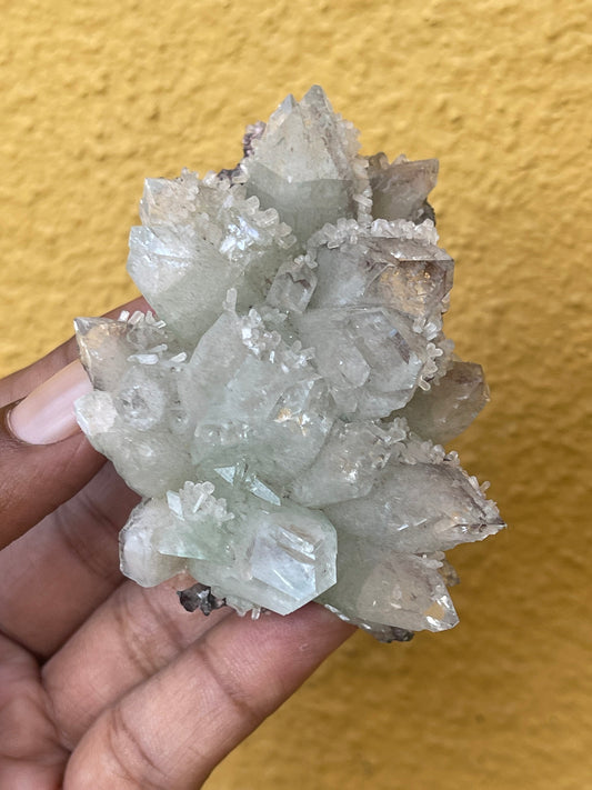 Pointed light green apophyllite flower with stilbite