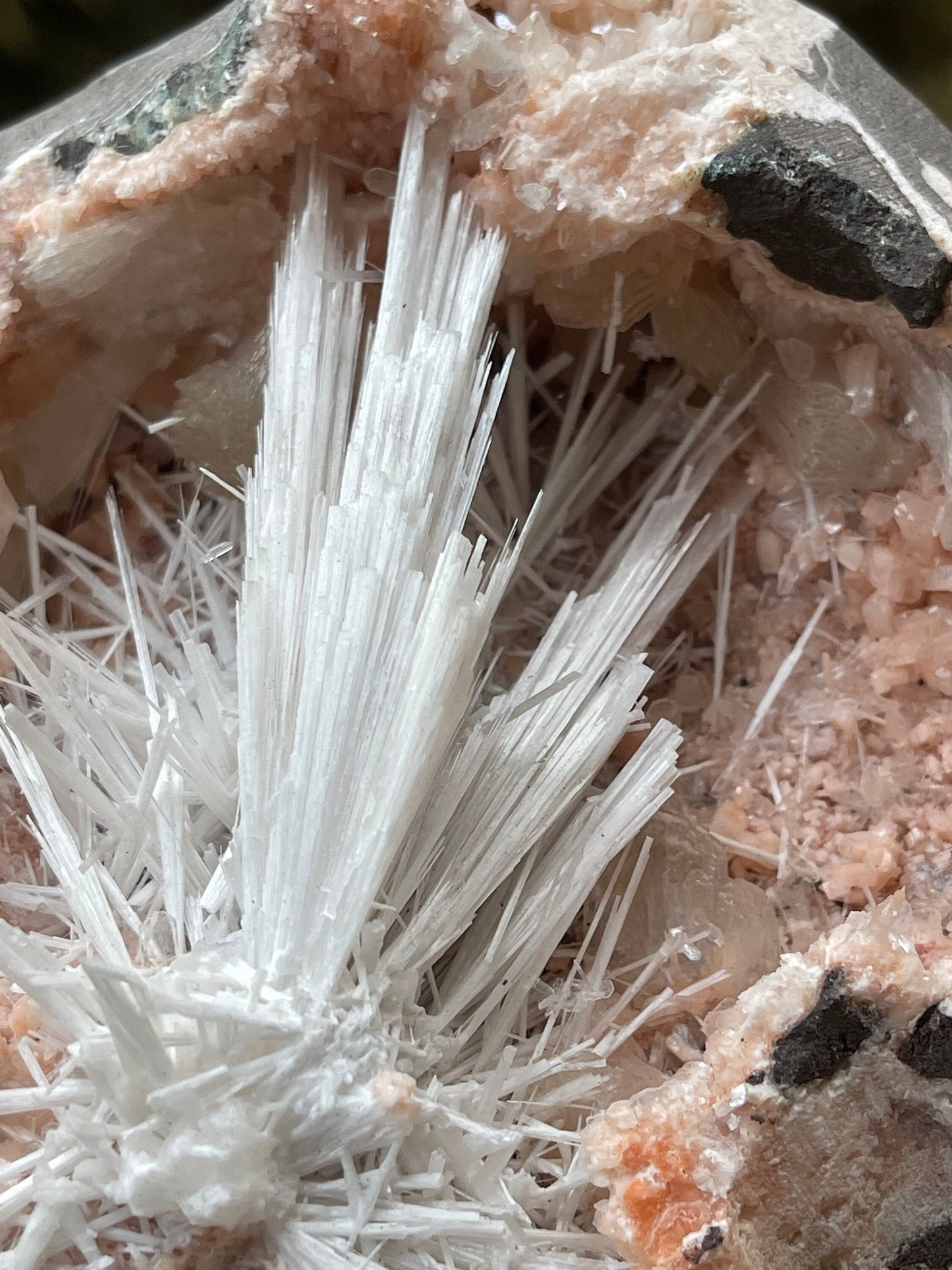 Scolecite flower inside orange haulandite geode
