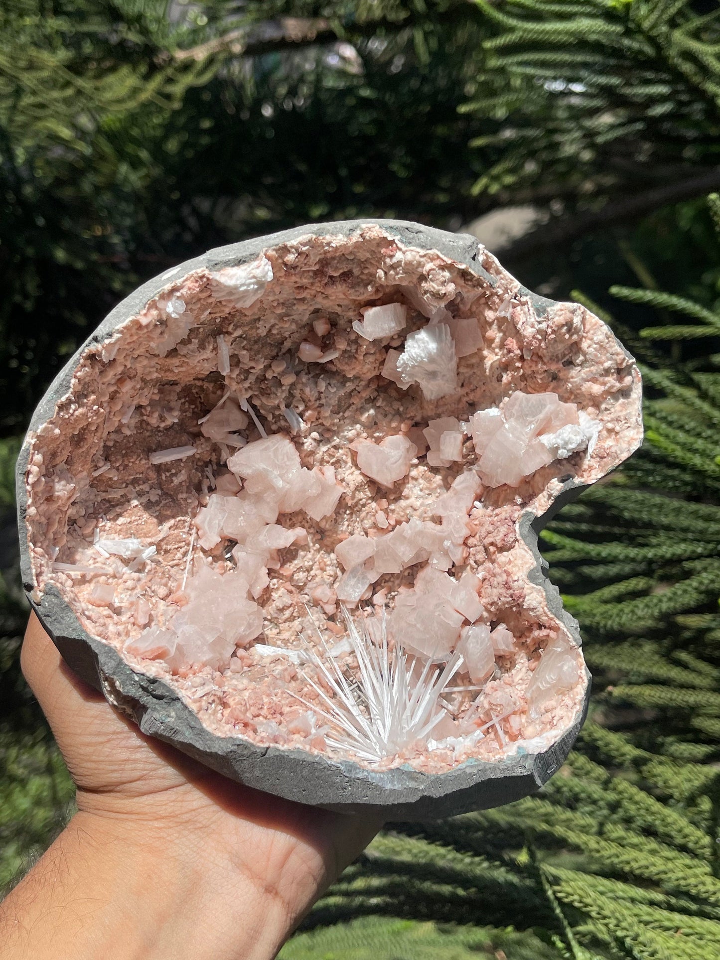 Scolecite spray inside orange heulandite geode
