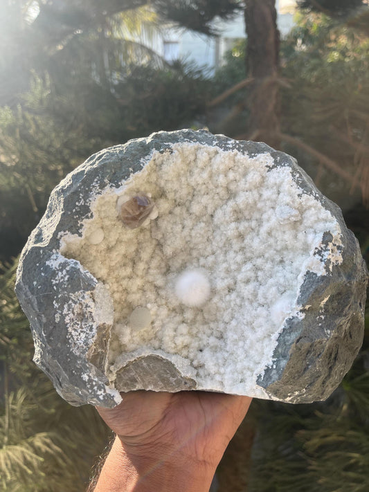 combination of okenite calcite gyrolite on white chalcedony matrix