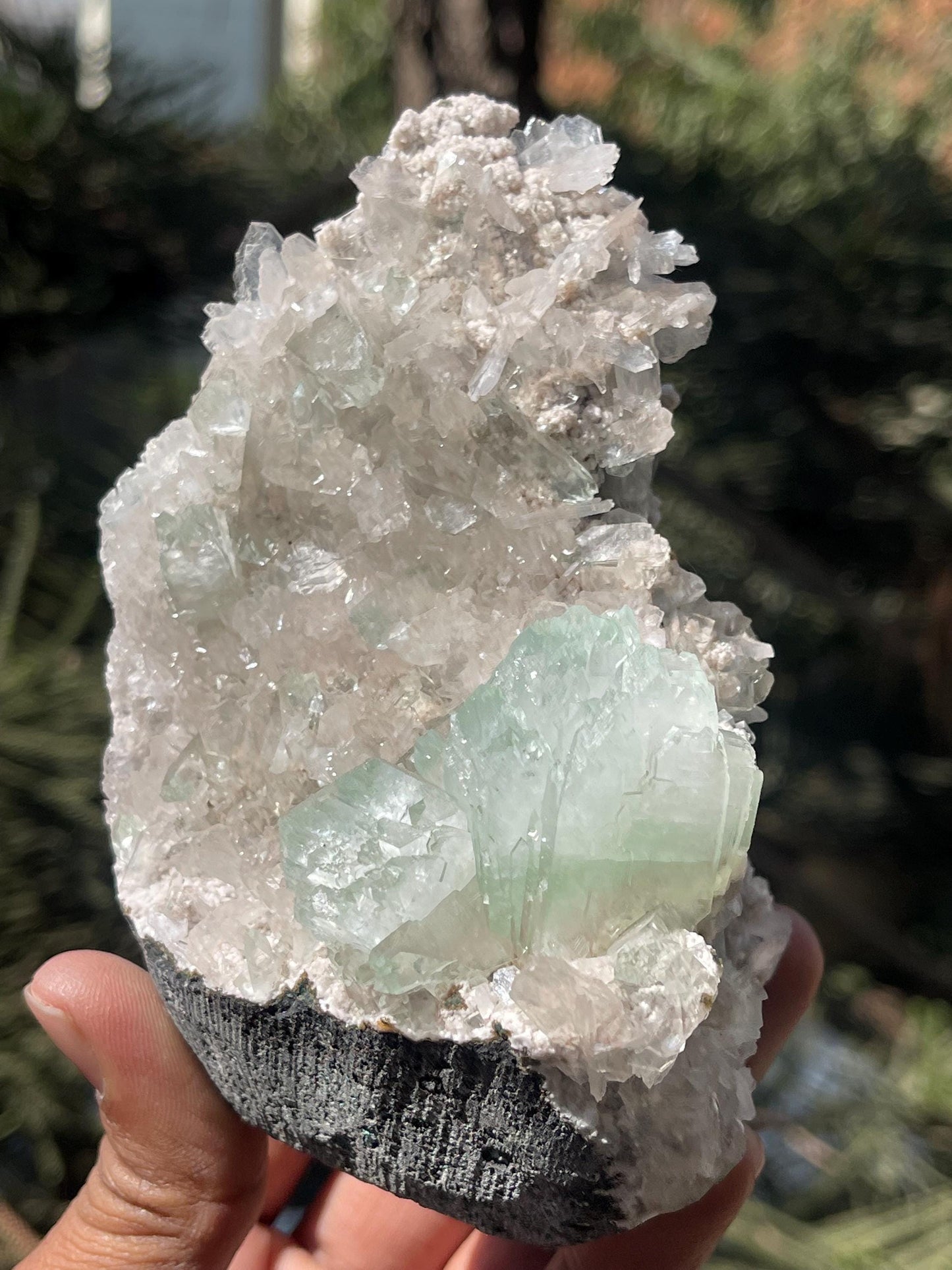 green apophyllite flower with small stilbite on chalcedony matrix