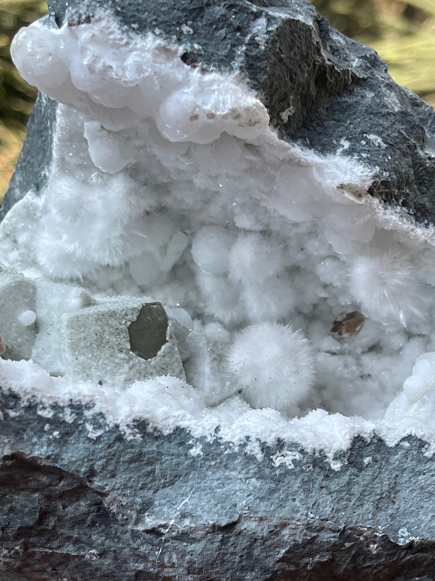 Okenite balls with calcite natural mineral geode