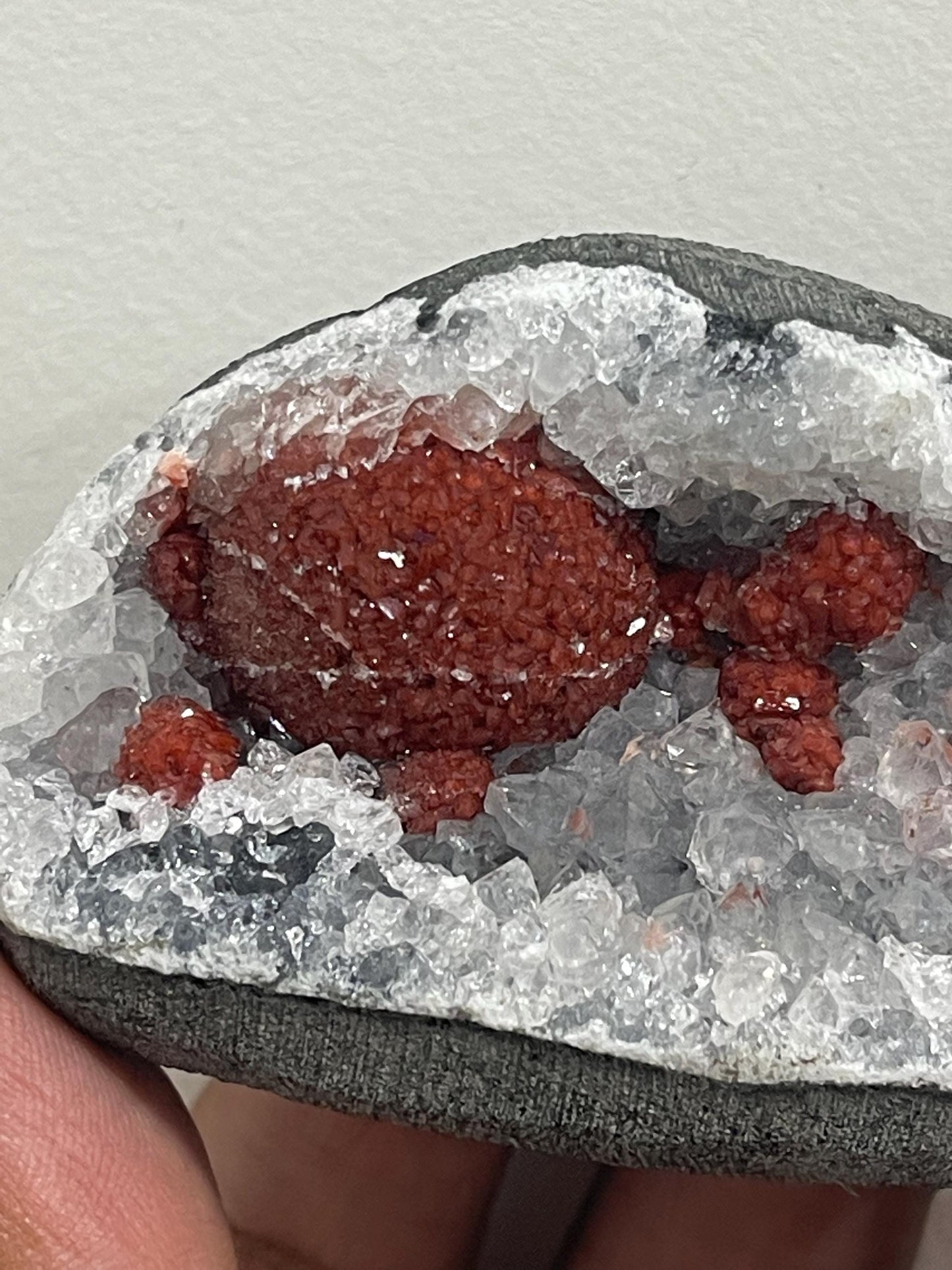 Rare find .. Red fluoride ball on blue quartz crystal
