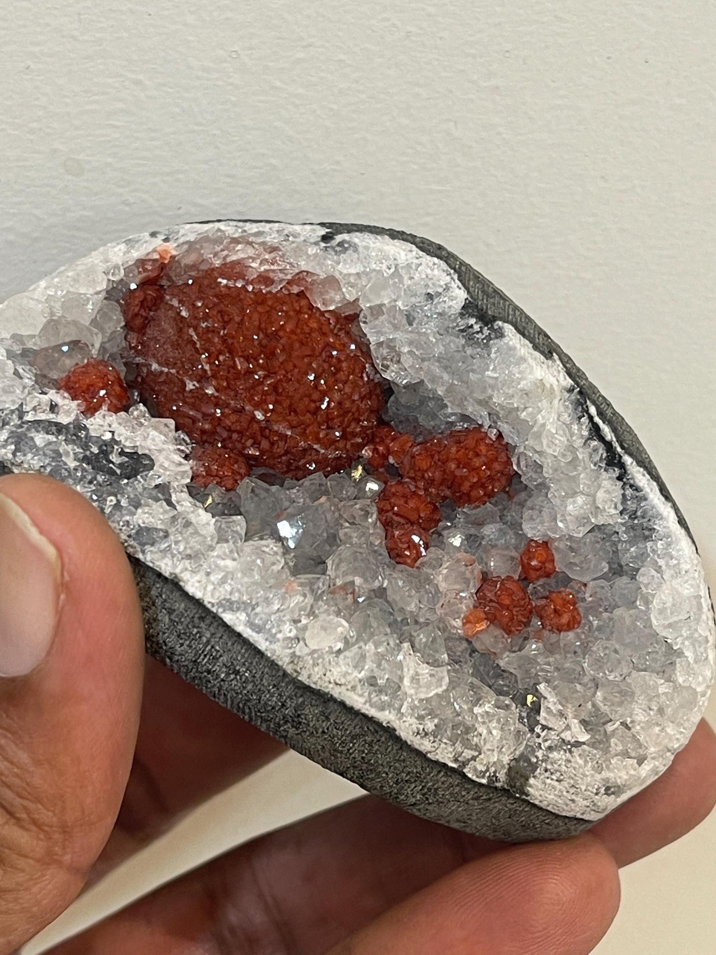 Rare find .. Red fluoride ball on blue quartz crystal