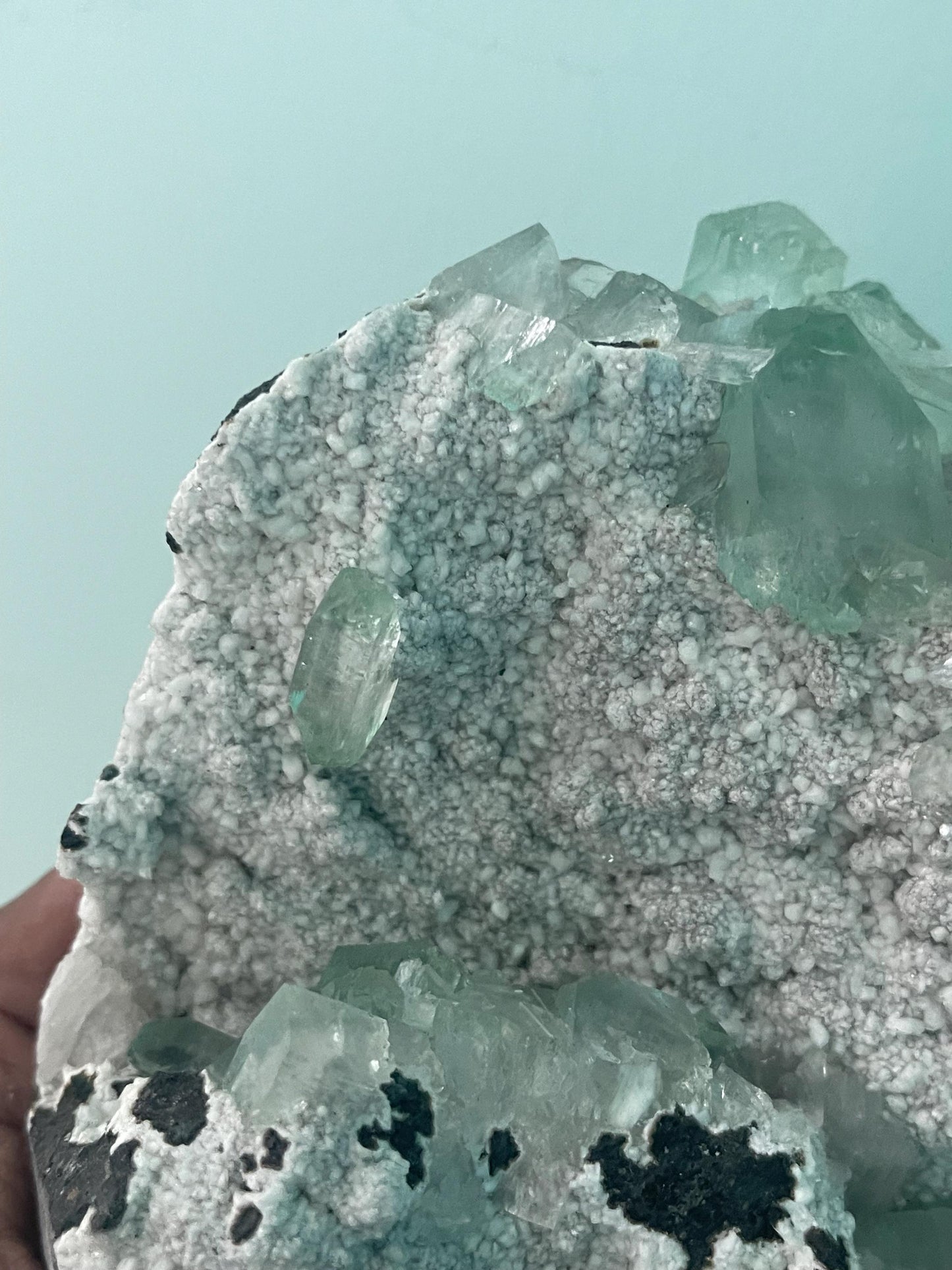 green apophyllite crystals on white chalcedony matrix