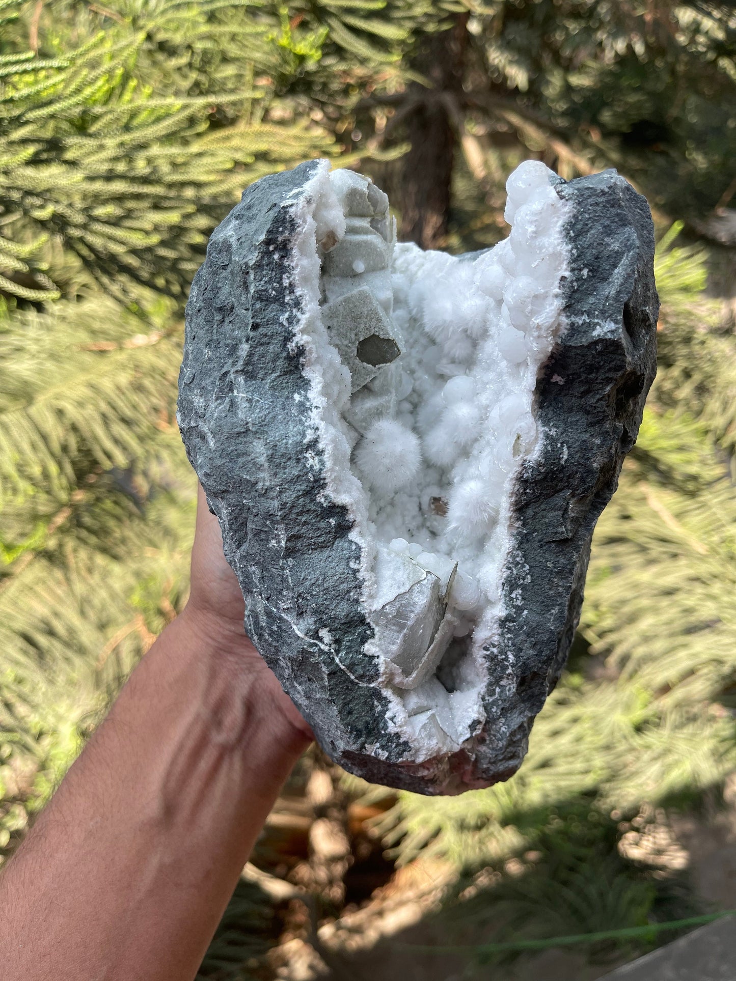 Okenite balls with calcite natural mineral geode