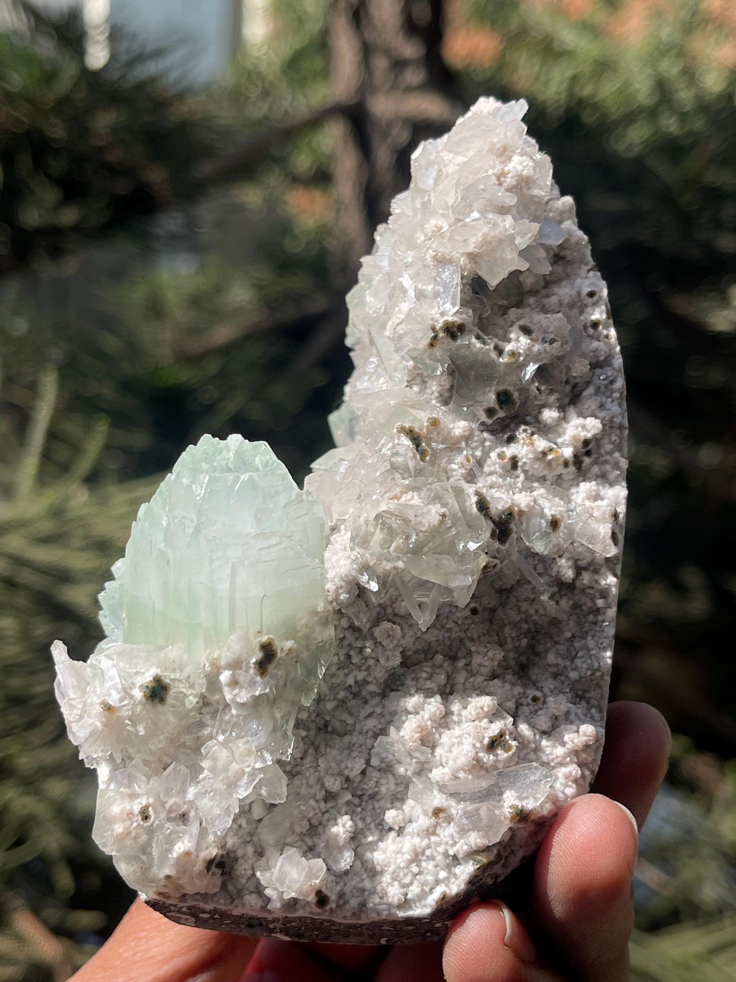 green apophyllite flower with small stilbite on chalcedony matrix