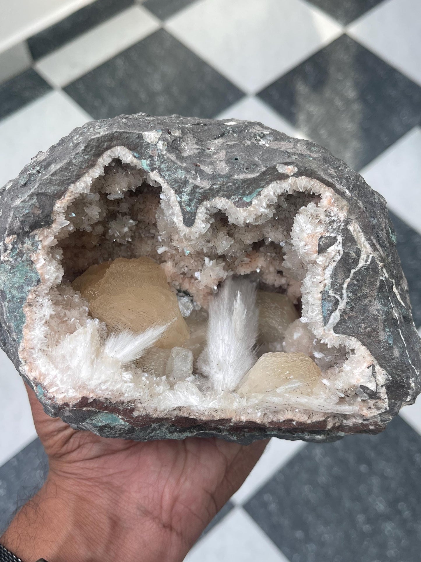Combination of Scolecite sprays and peach stilbites inside heulandite geode
