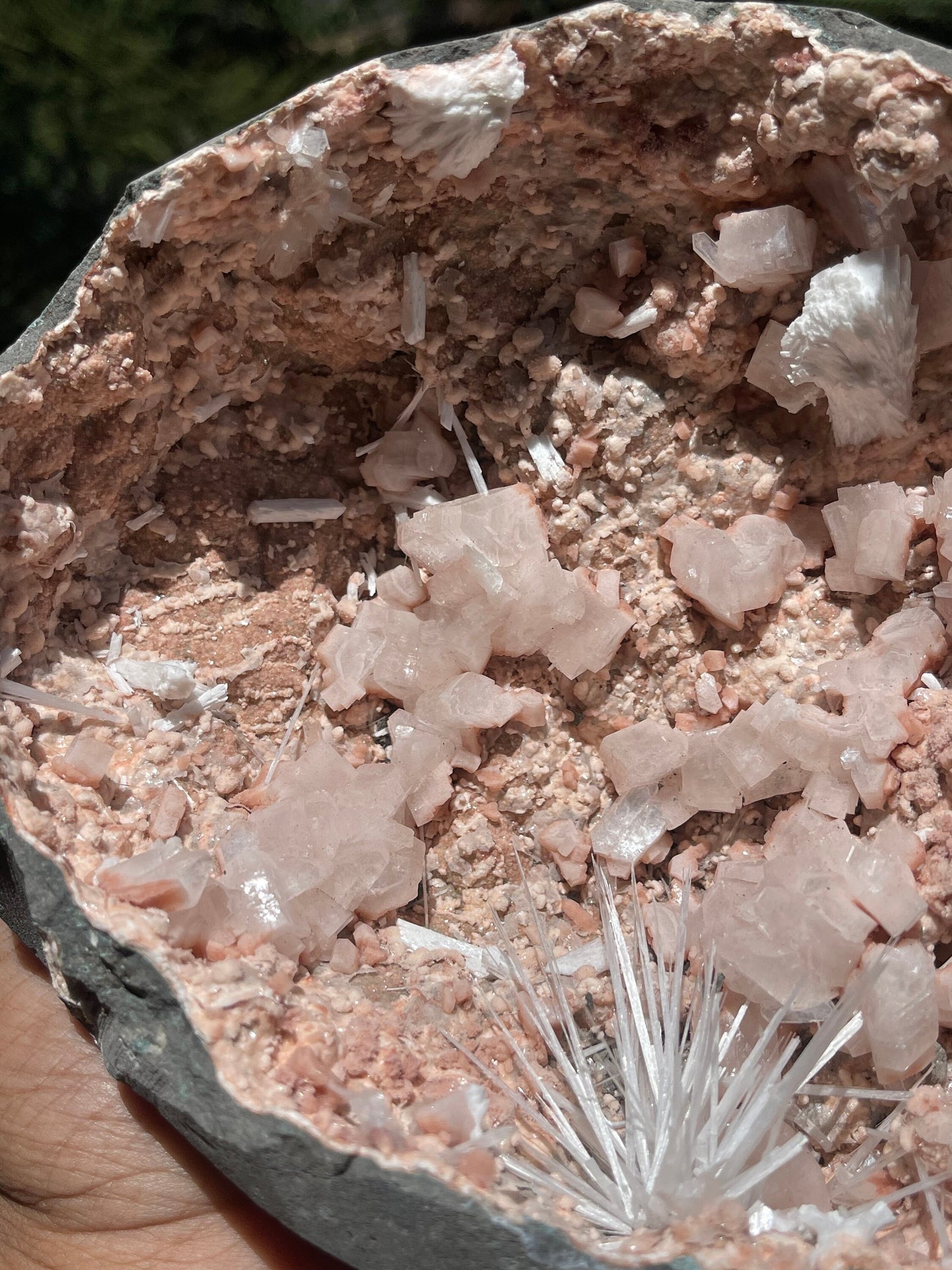 Scolecite spray inside orange heulandite geode