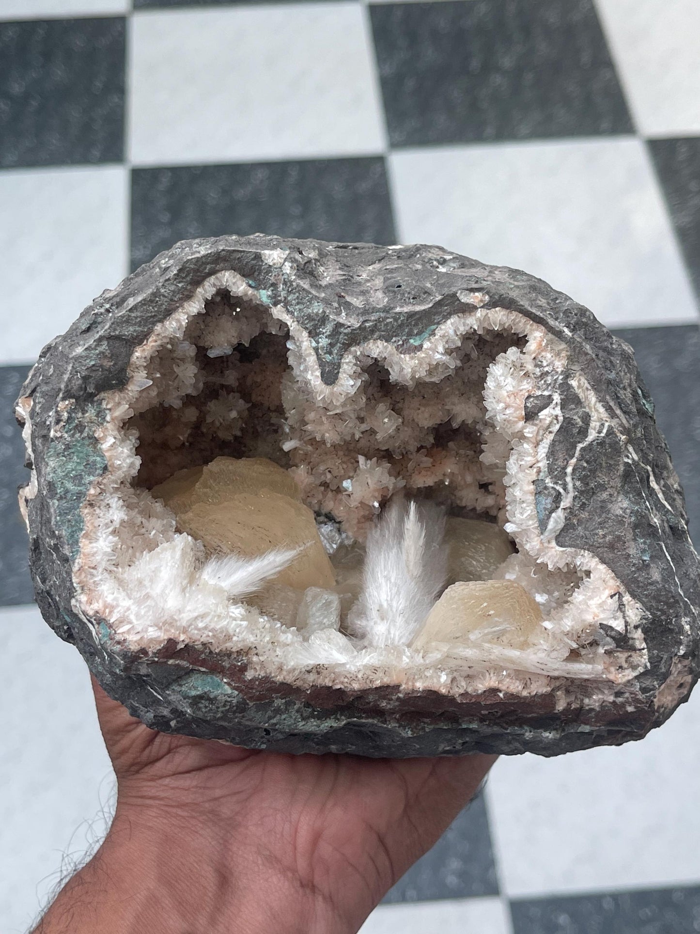 Combination of Scolecite sprays and peach stilbites inside heulandite geode