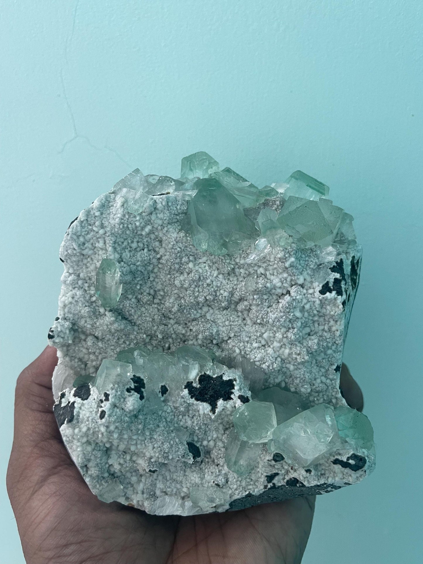 green apophyllite crystals on white chalcedony matrix